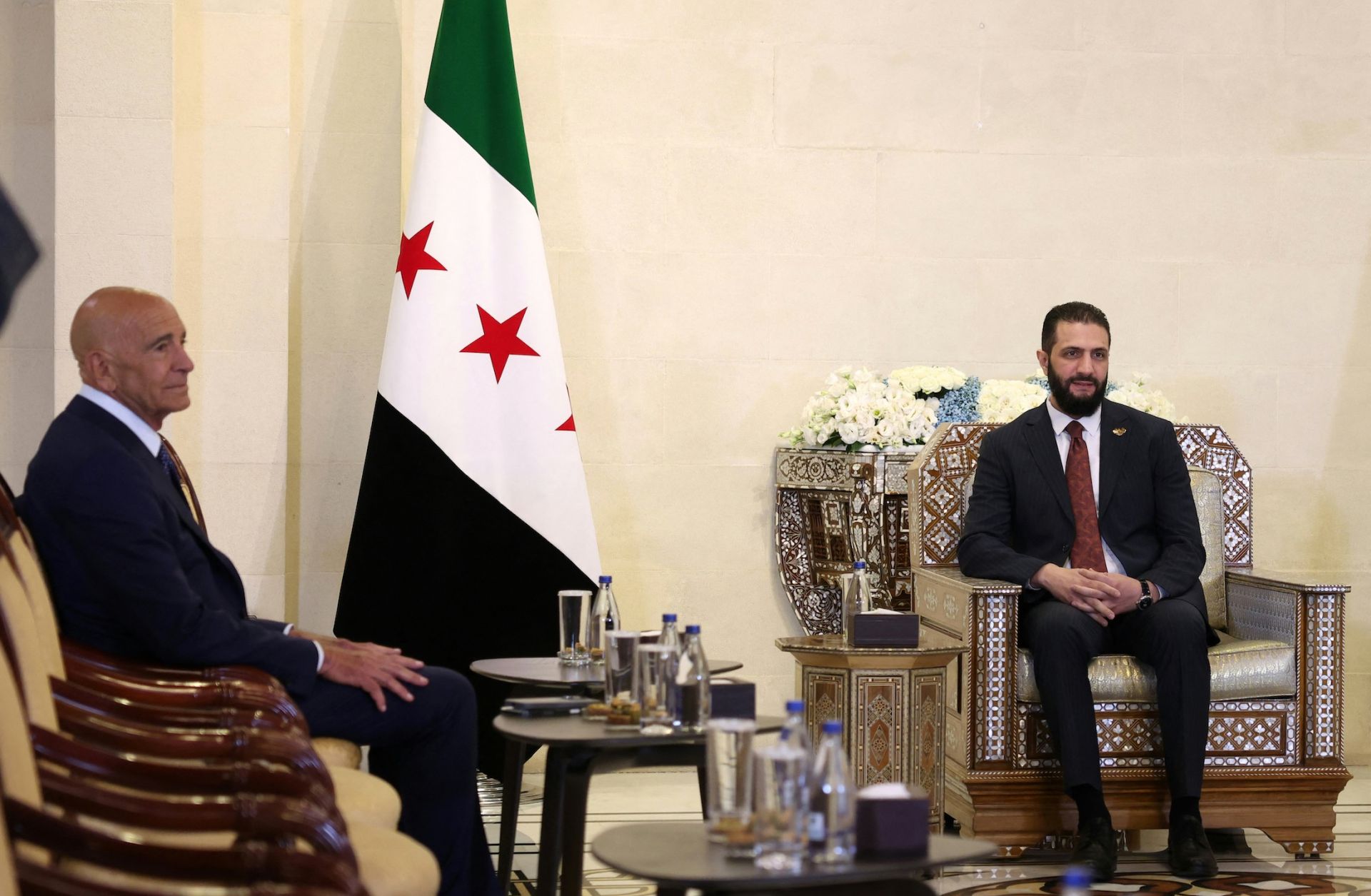 Syria's interim President Ahmad al-Sharaa (right) meets with U.S. envoy to Syria, Tom Barrack, at the presidential palace in Damascus on July 9, 2025. Syria's interim President Ahmad al-Sharaa (right) meets with U.S. envoy to Syria, Tom Barrack, at the presidential palace in Damascus on July 9, 2025.