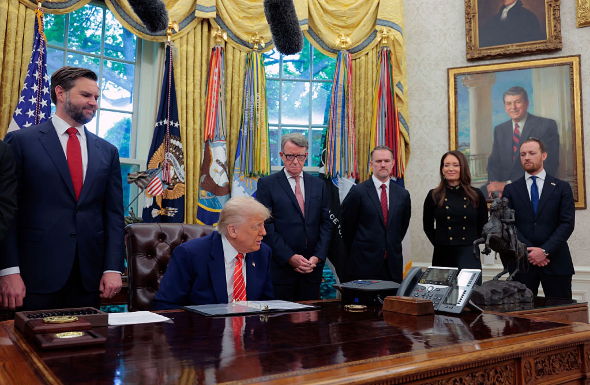 U.S. President Donald Trump -- flanked by Vice President JD Vance (left) and Peter Mandelson, the U.K. ambassador to the United States (right) -- holds a phone call with U.K. Prime Minister Keir Starmer in the Oval Office of the White House on May 8, 2025. U.S. President Donald Trump -- flanked by Vice President JD Vance (left) and Peter Mandelson, the U.K. ambassador to the United States (right) -- holds a phone call with U.K. Prime Minister Keir Starmer in the Oval Office of the White House on May 8, 2025.