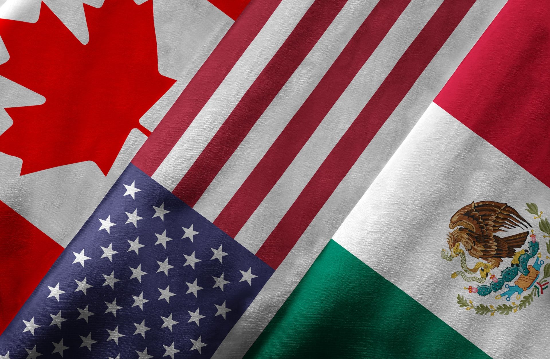 A 3D rendering of the Canadian, U.S. and Mexican flags.