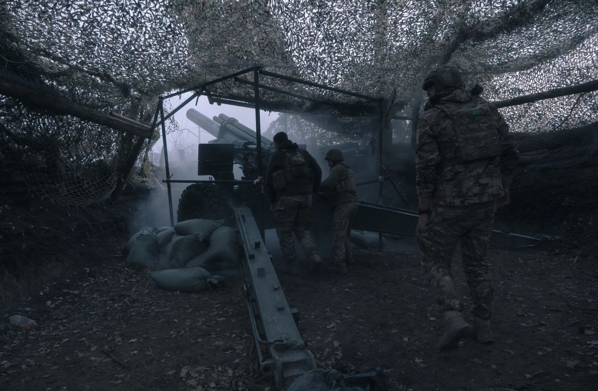 Ukrainian artillerymen operate a U.S.-made M-114 howitzer near Pokrovsk, Ukraine, on Oct. 16, 2025.