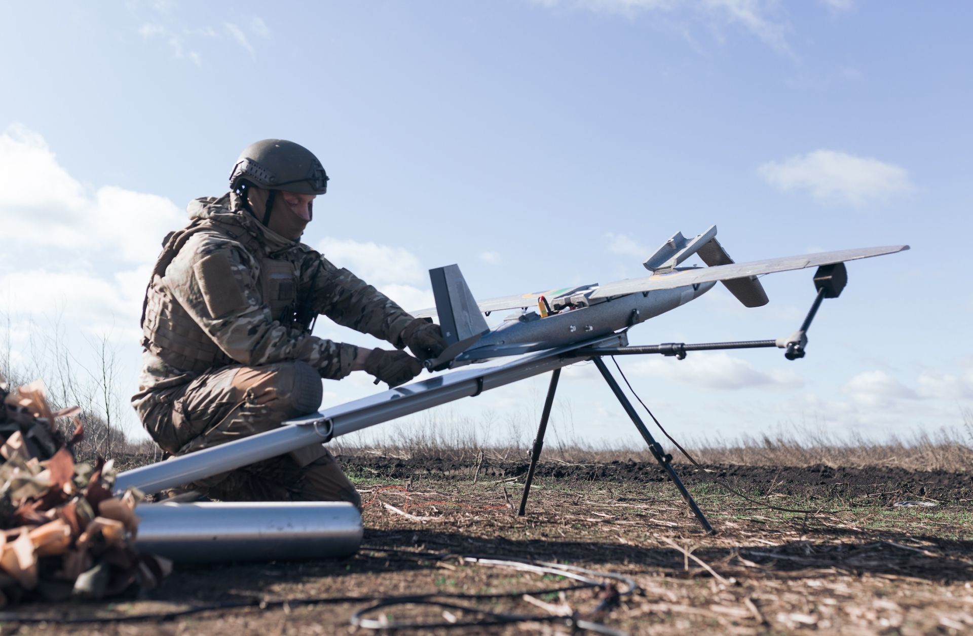 A soldier from the "Taifun" unmanned aerial vehicle unit prepares a new strike drone for flight on April 7, 2026 in Ukraine. 