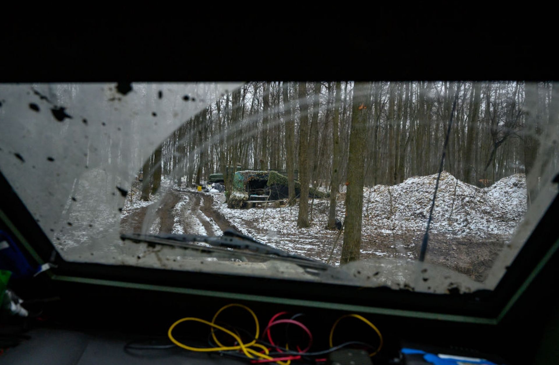 A photo taken on Jan. 15, 2025, shows a muddy track running through a forest in Sumy, Ukraine, that Ukrainian soldiers use to transport American Stryker armored fighting vehicles during Ukraine's ongoing cross-border operation into Russia's Kursk region.