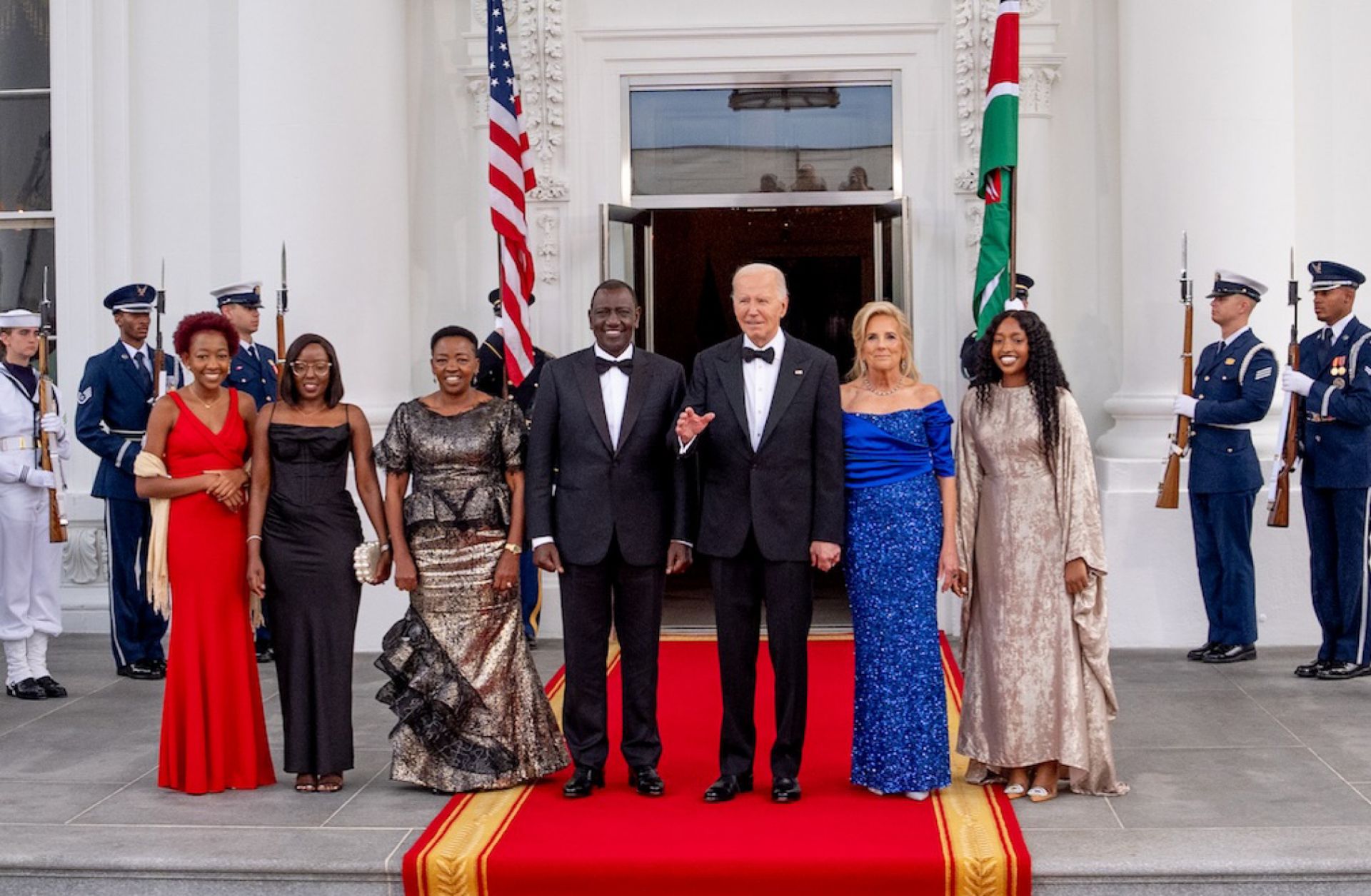 U.S. President Joe Biden and First Lady Jill Biden pose with Kenyan President William Ruto (center), alongside his wife and children, as they arrive for a State Dinner at the White House on May 23, 2024. 