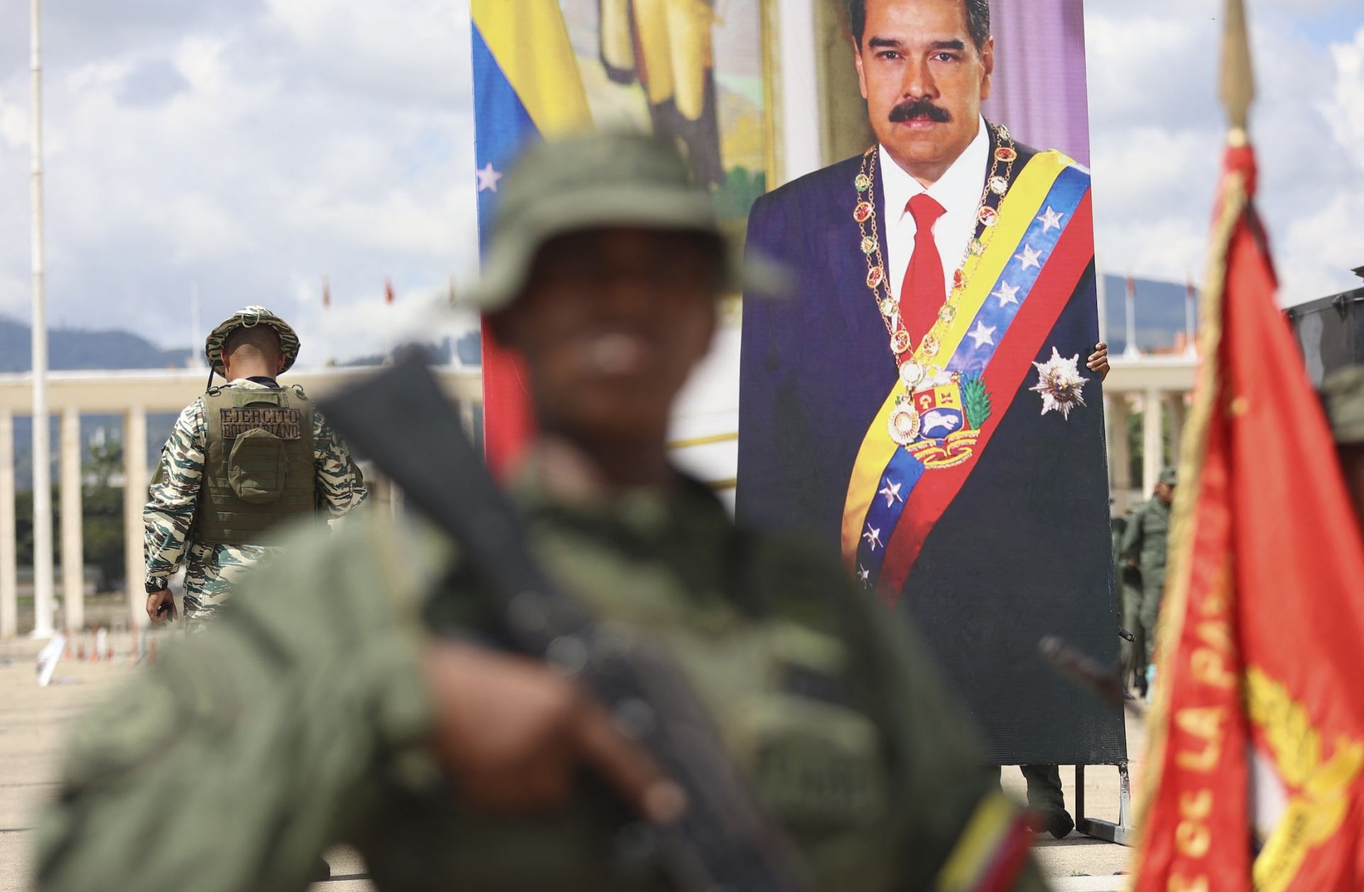 A poster displaying a photo of Venezuelan President Nicolas Maduro is seen as members of the Bolivarian Armed Forces take part in a military exercise in Caracas on Sept. 20, 2025. 