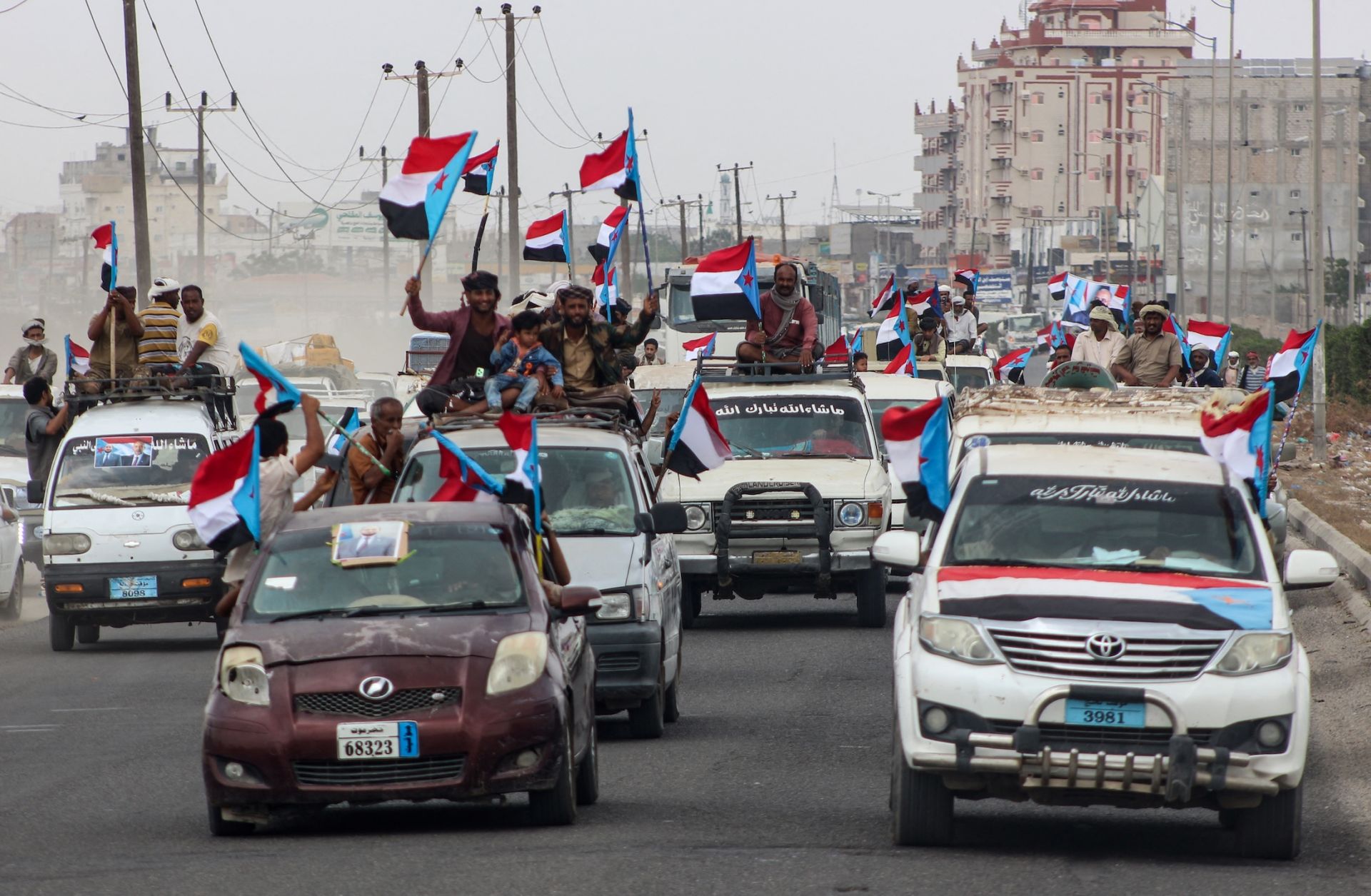 Yemenis gather during a rally to show their support for the UAE-backed Southern Transitional Council (STC), which wants to revive an independent South Yemen, as they wave the old South Yemen flag in Khormaksar Square, in the coastal port city of Aden on Dec. 14, 2025. 