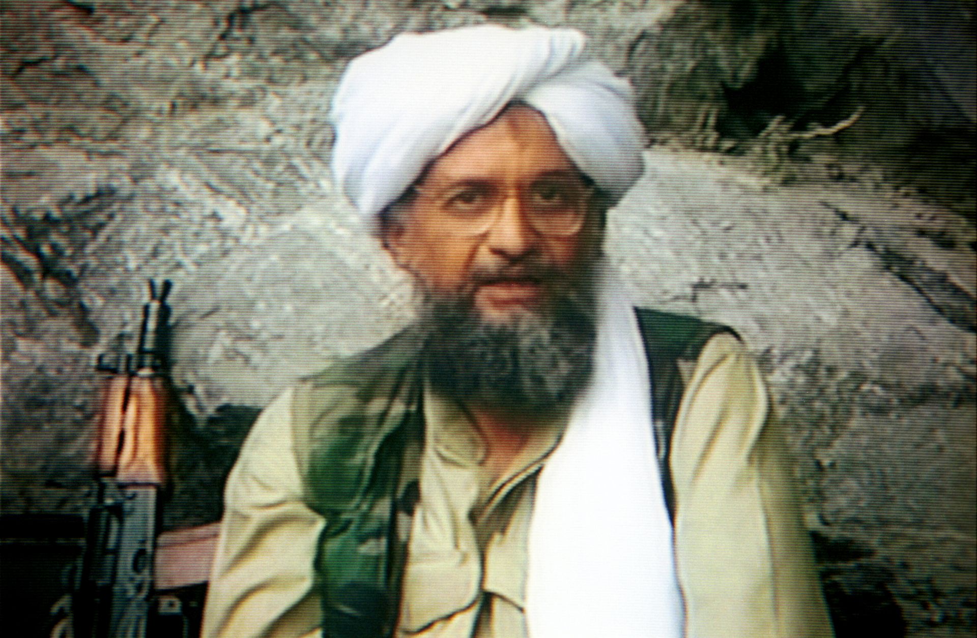 Ayman al-Zawahiri is seen on a television screen during a broadcast report. 