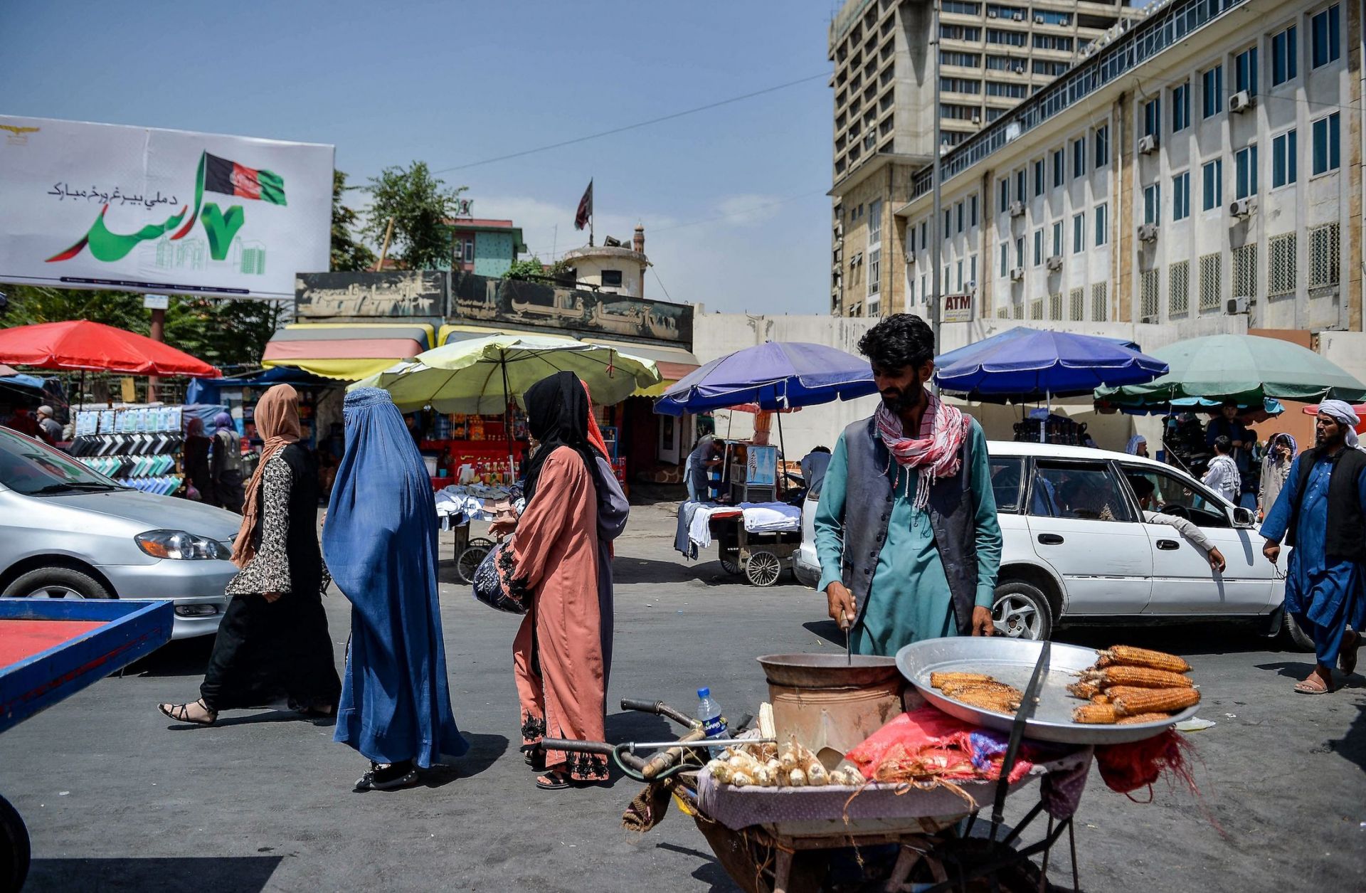 Afghan women shop at a market area in Kabul on Aug. 23, 2021, following the Taliban's takeover of the country.