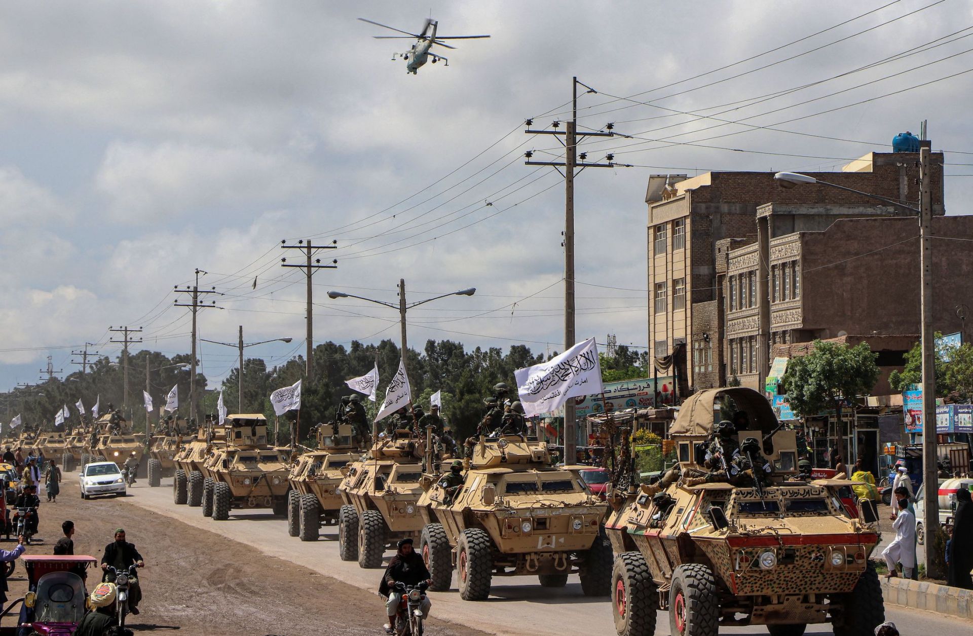 Taliban fighters in armored vehicles in a military parade on April 19, 2022, in Herat, Afghanistan.