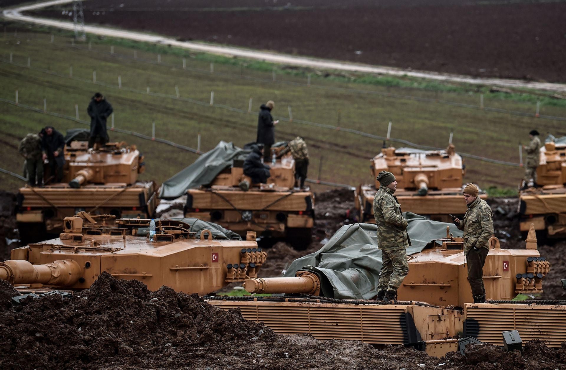 Turkish tanks and troops wait along the Syrian border Jan. 25, 2018, during Operation Olive Branch, an incursion into Afrin canton.
