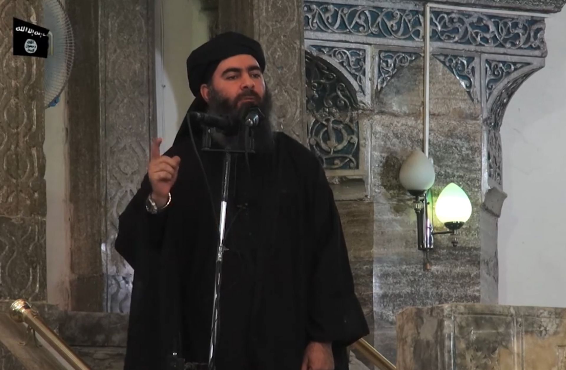 An image grab from a 2014 propaganda video released by al-Furqan media allegedly showing Islamic State Abu Bakr al-Baghdadi addressing worshippers at a mosque in the Iraqi city of Mosul.