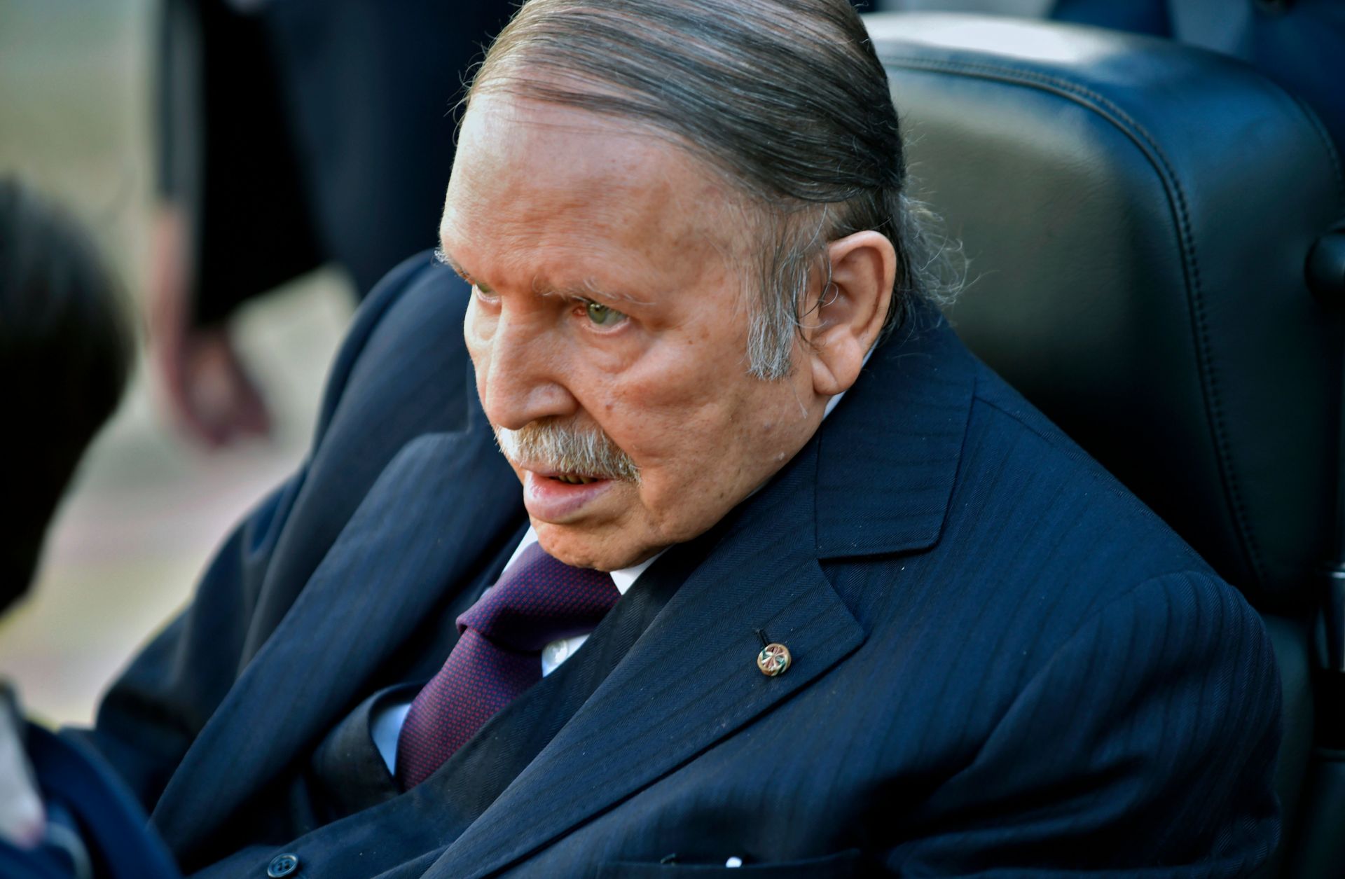 Algerian President Abdel Aziz Bouteflika is seen heading to vote at a polling station in Algiers on November 23, 2017.