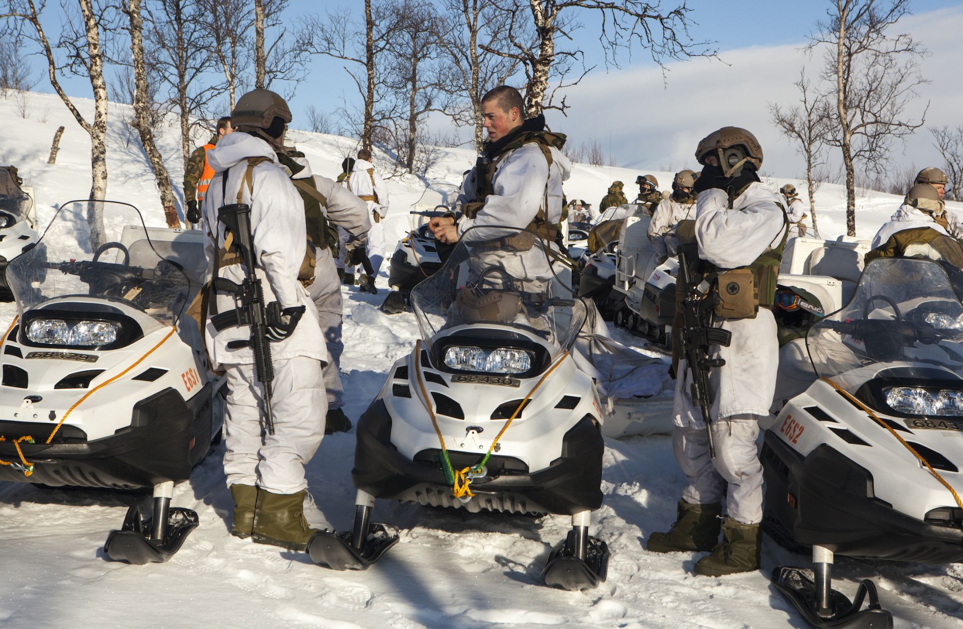 Norwegian army soldiers use snowmobiles for mobility during a military exercise on March 6, 2013, in Skjold, Norway. 