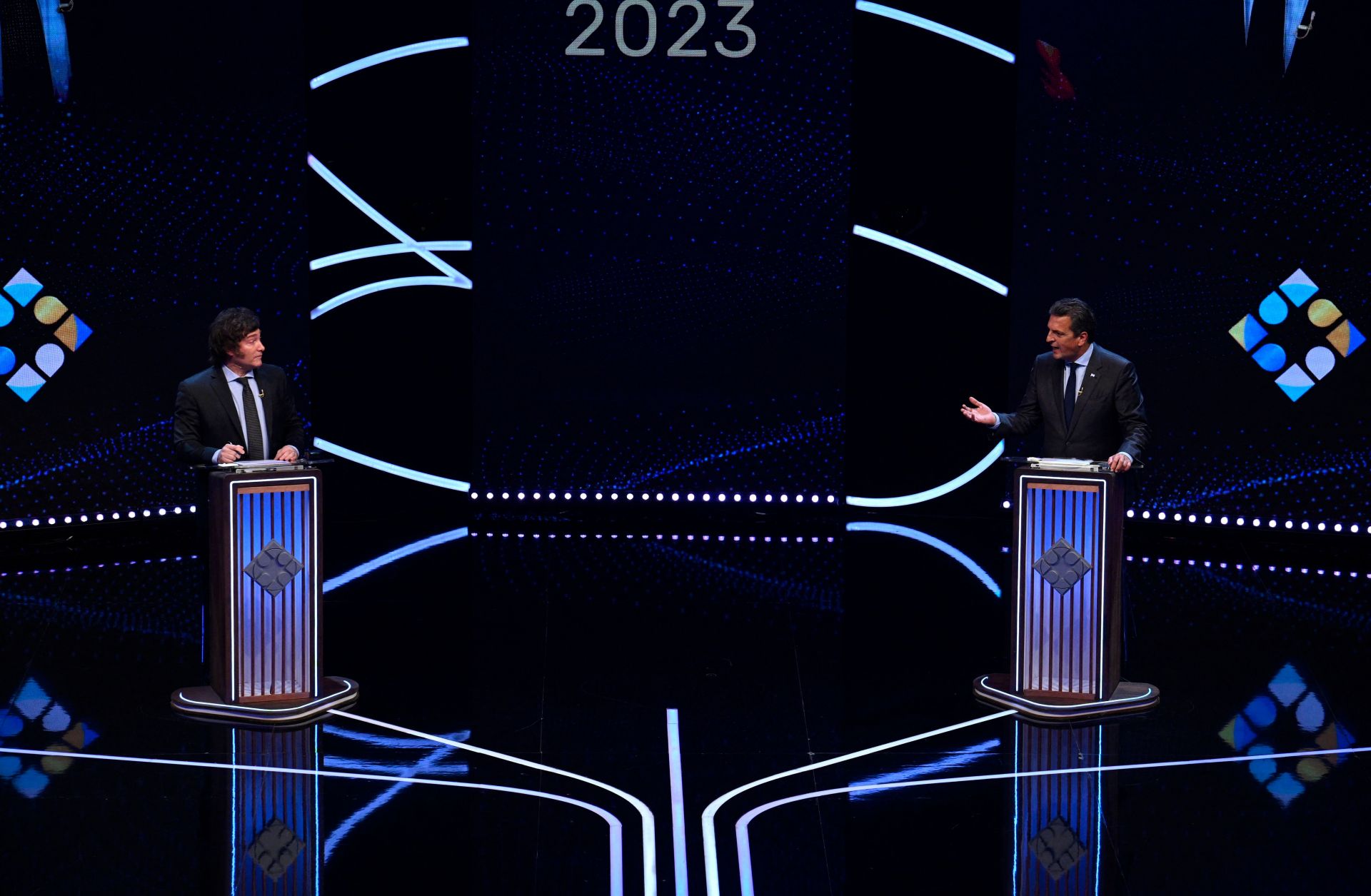 The presidential candidate for the Union por la Patria party, Sergio Massa (R), speaks next to the presidential candidate for the La Libertad Avanza party, Javier Milei, on Nov. 12, 2023, during a presidential debate in Buenos Aires, Argentina.