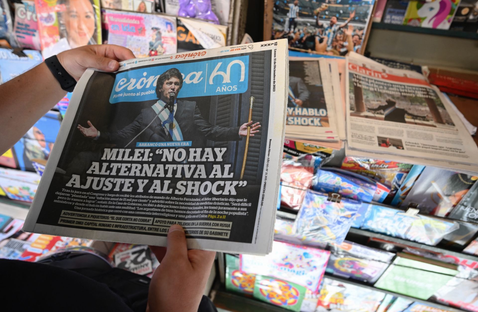 A vendor sells newspapers showing the inauguration of Argentine President Javier Milei on the covers in Buenos Aires, Argentina, on Dec. 11, 2023. 