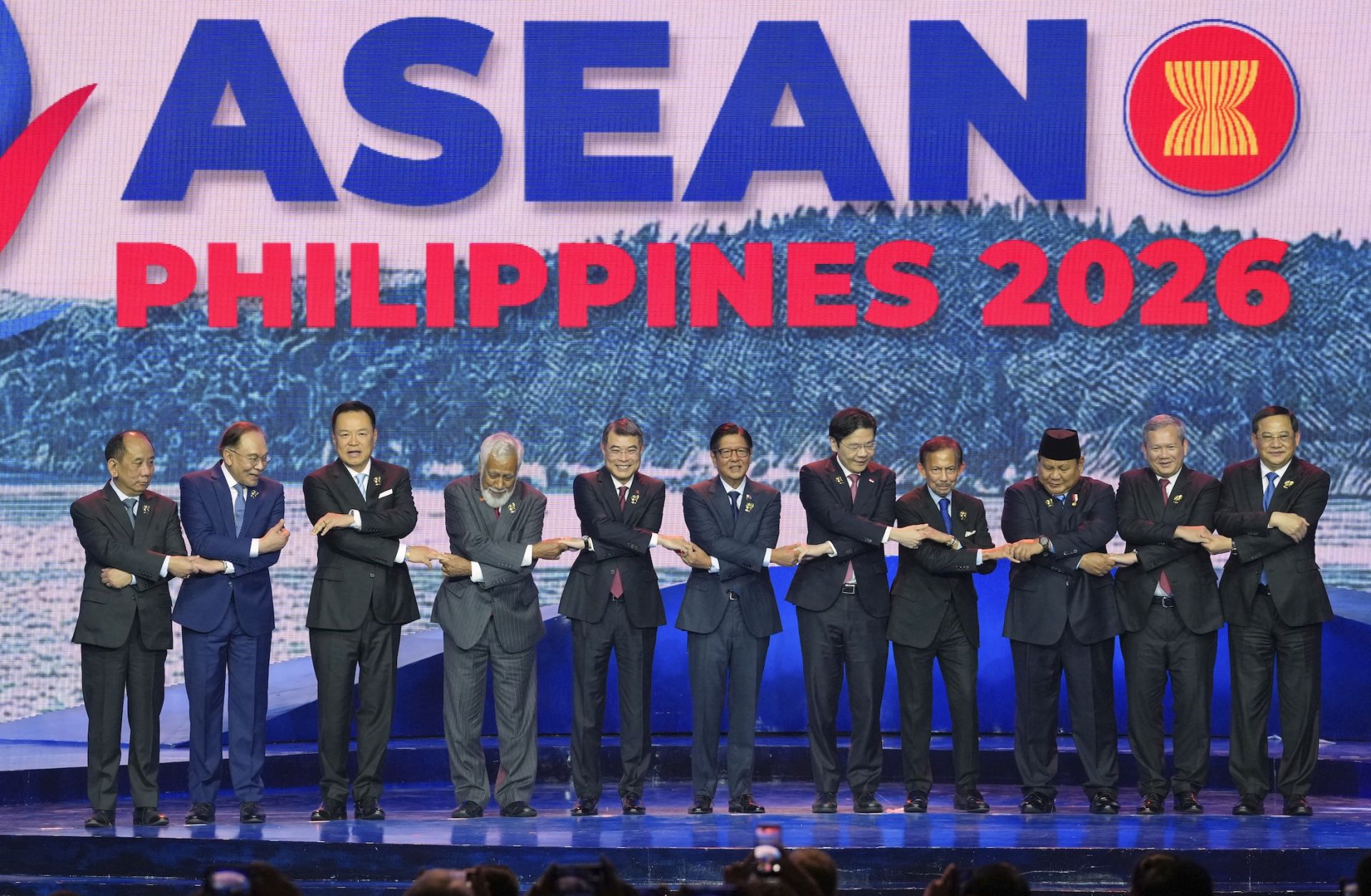 ASEAN leaders hold hands for a group photo during the opening ceremony of the 48th ASEAN summit in Cebu, central Philippines on May 8, 2026. 