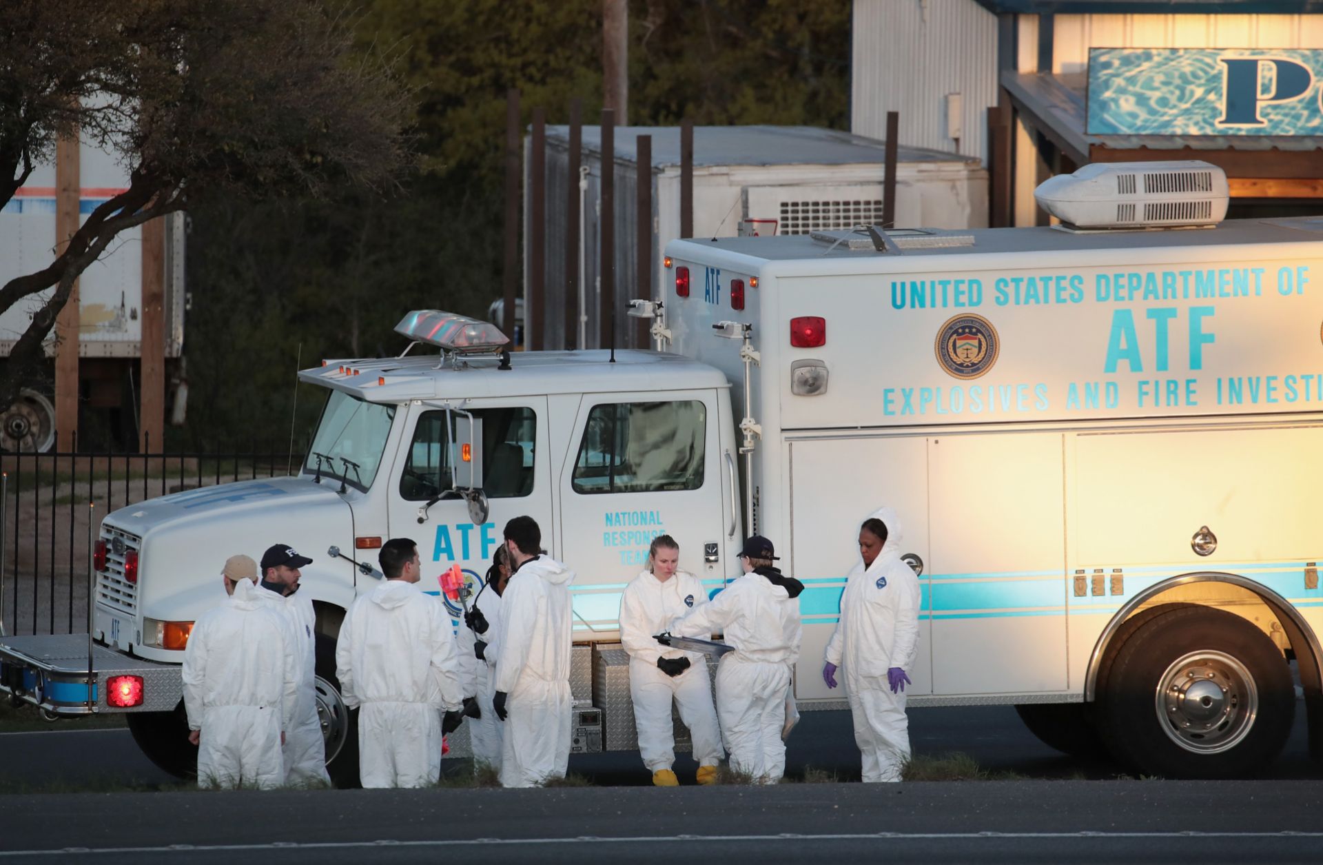 A picture shows evidence technicians in Round Rock, Texas, searching for evidence at the site where serial bomber Mark Anthony Conditt ended his life with a self-inflicted bomb blast.