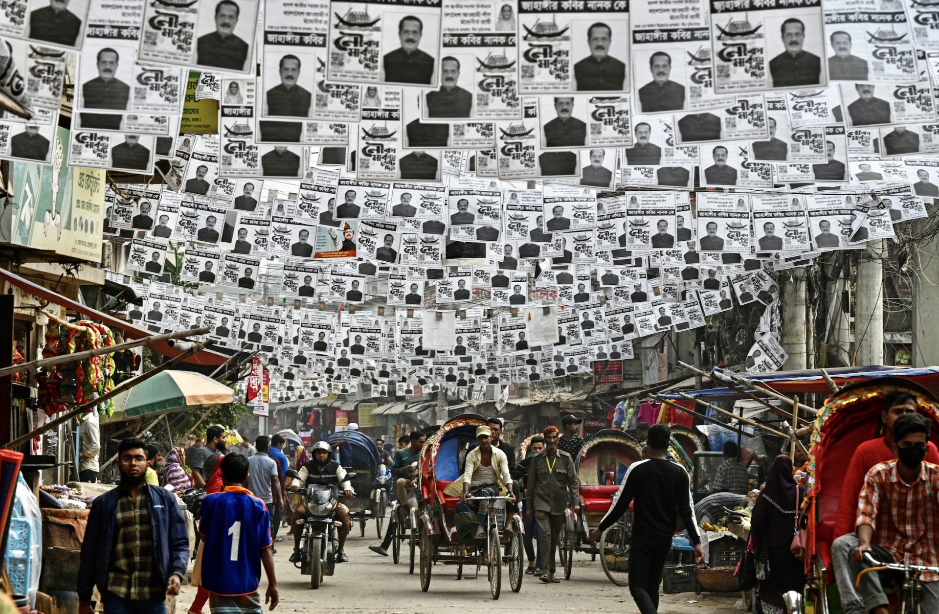 Posters of Bangladesh's election candidates hang over a street in Dhaka on Dec. 26, 2023, ahead of the 2024 general elections.