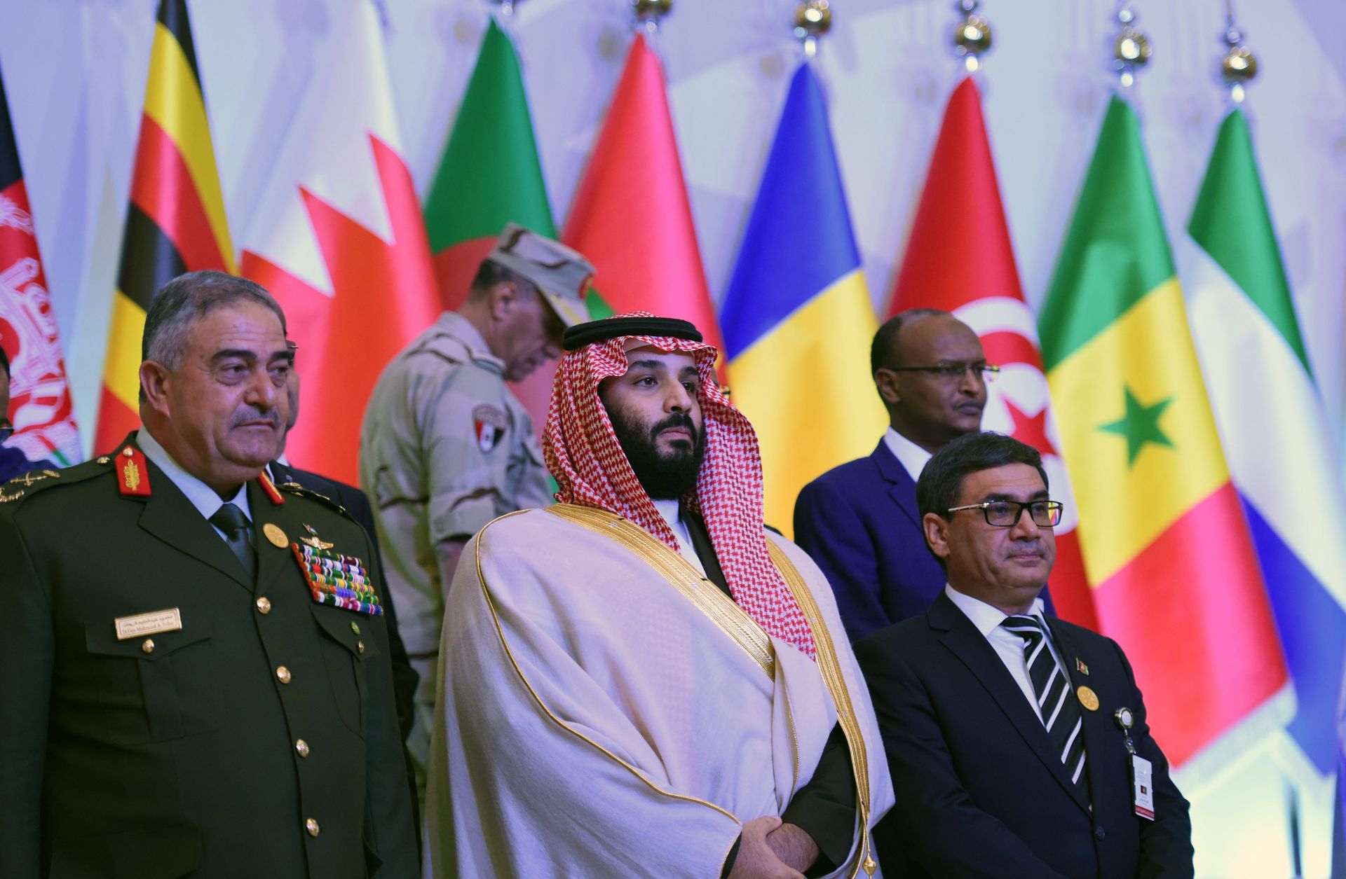 Saudi Defense Minister and Crown Prince Mohammed bin Salman, center, stands for a photo-op with his counterparts from other countries in Saudi Arabia's Islamic Military Counterterrorism Coalition at a meeting in Riyadh.