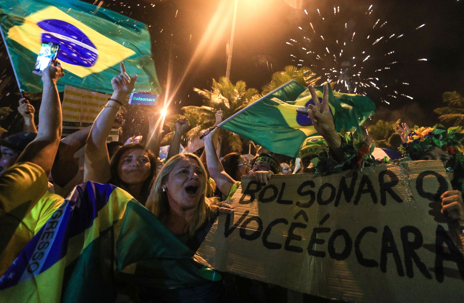 Brazilian supporters of populist candidate Jair Bolsonaro celebrate his presidential victory on Oct. 28.