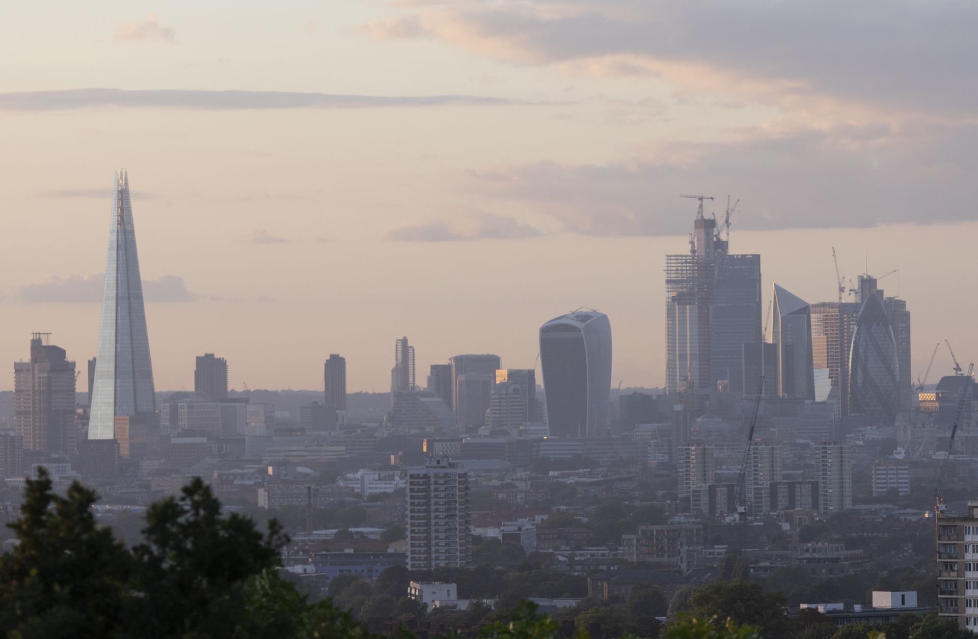The skyline in London is all aglow as the sun sets on Aug. 16, 2018.