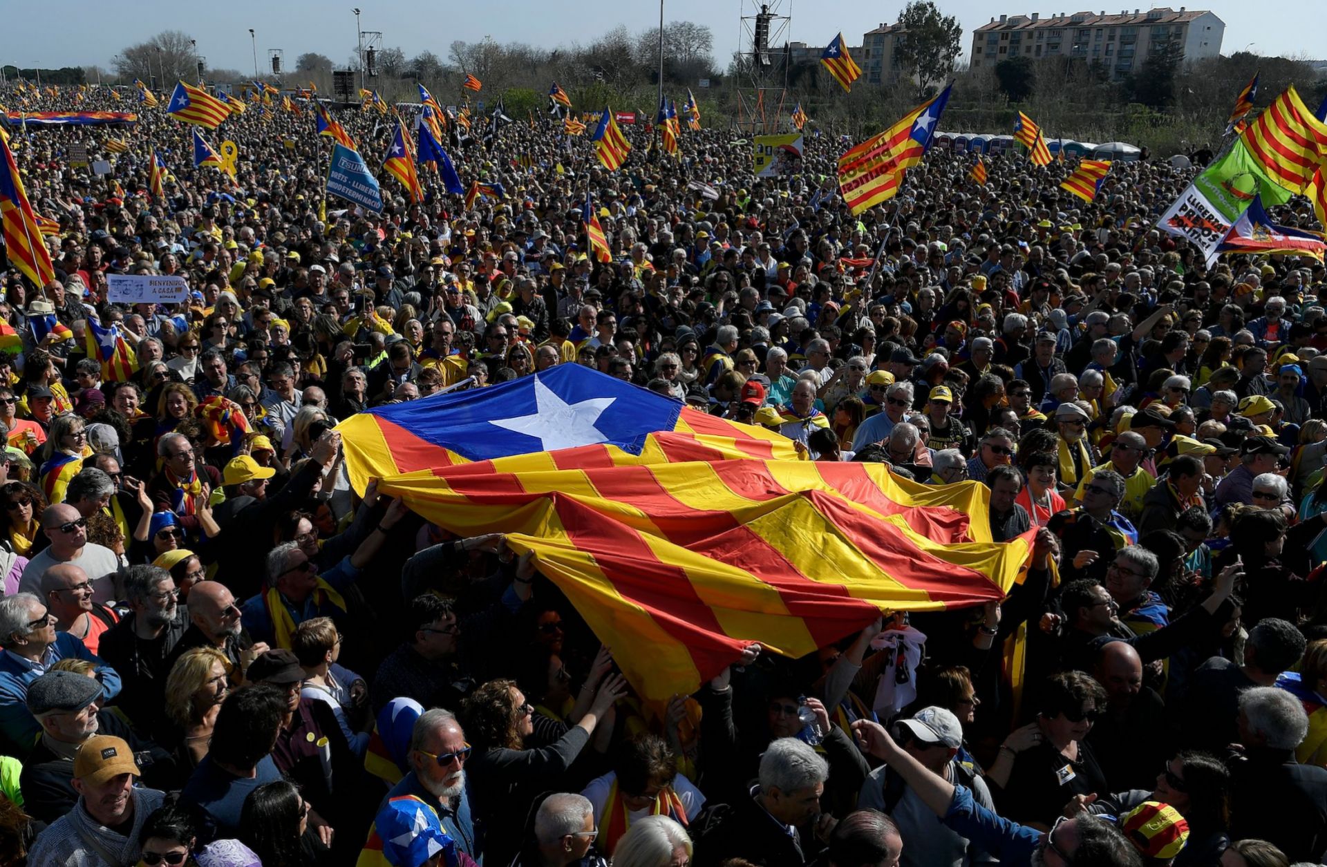 Demonstrators hold a Catalonian flag ahead of a political meeting in Perpignan, France, on Feb. 29, 2020. 