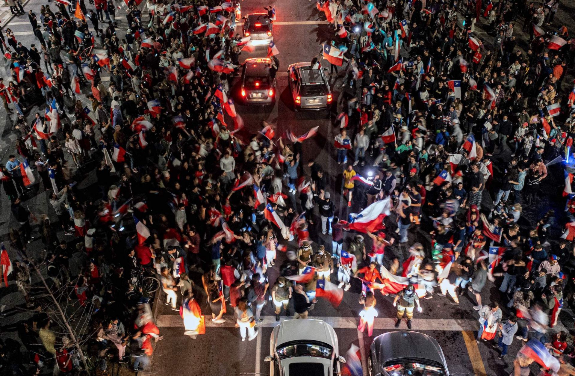 People opposed to Chile's proposed new constitution celebrate in the streets of Santiago on Sept. 4, 2022, after the first results of the referendum showed the number of ''no'' votes far exceeding the number of ''yes'' votes. 
