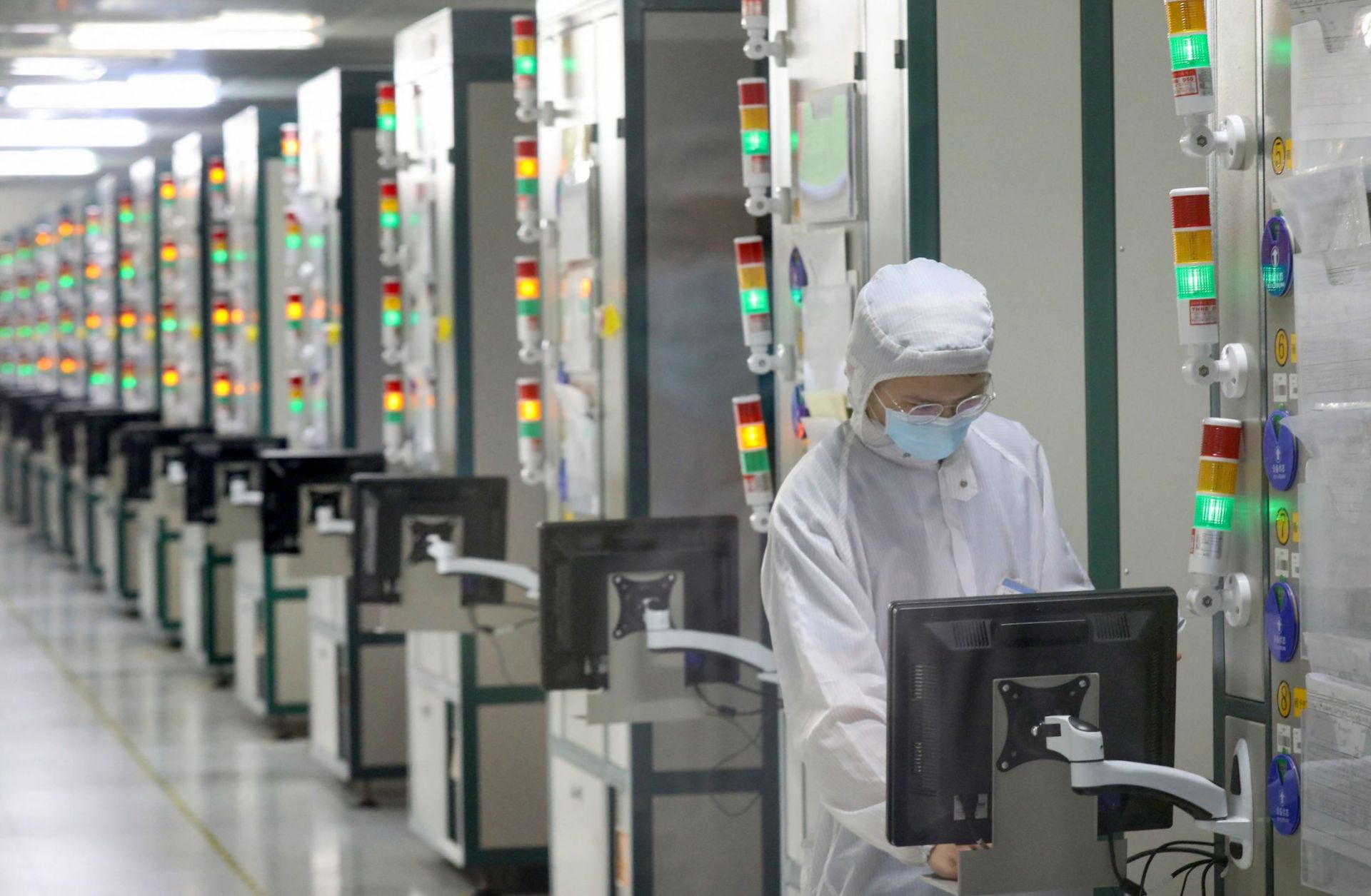 An employee works at a Jiangsu JieJie Microelectronics Co. Ltd. factory in Nantong, a city in eastern China's Jiangsu province on March 17, 2021. An employee works at a Jiangsu JieJie Microelectronics Co. Ltd. factory in Nantong, a city in eastern China's Jiangsu province on March 17, 2021.