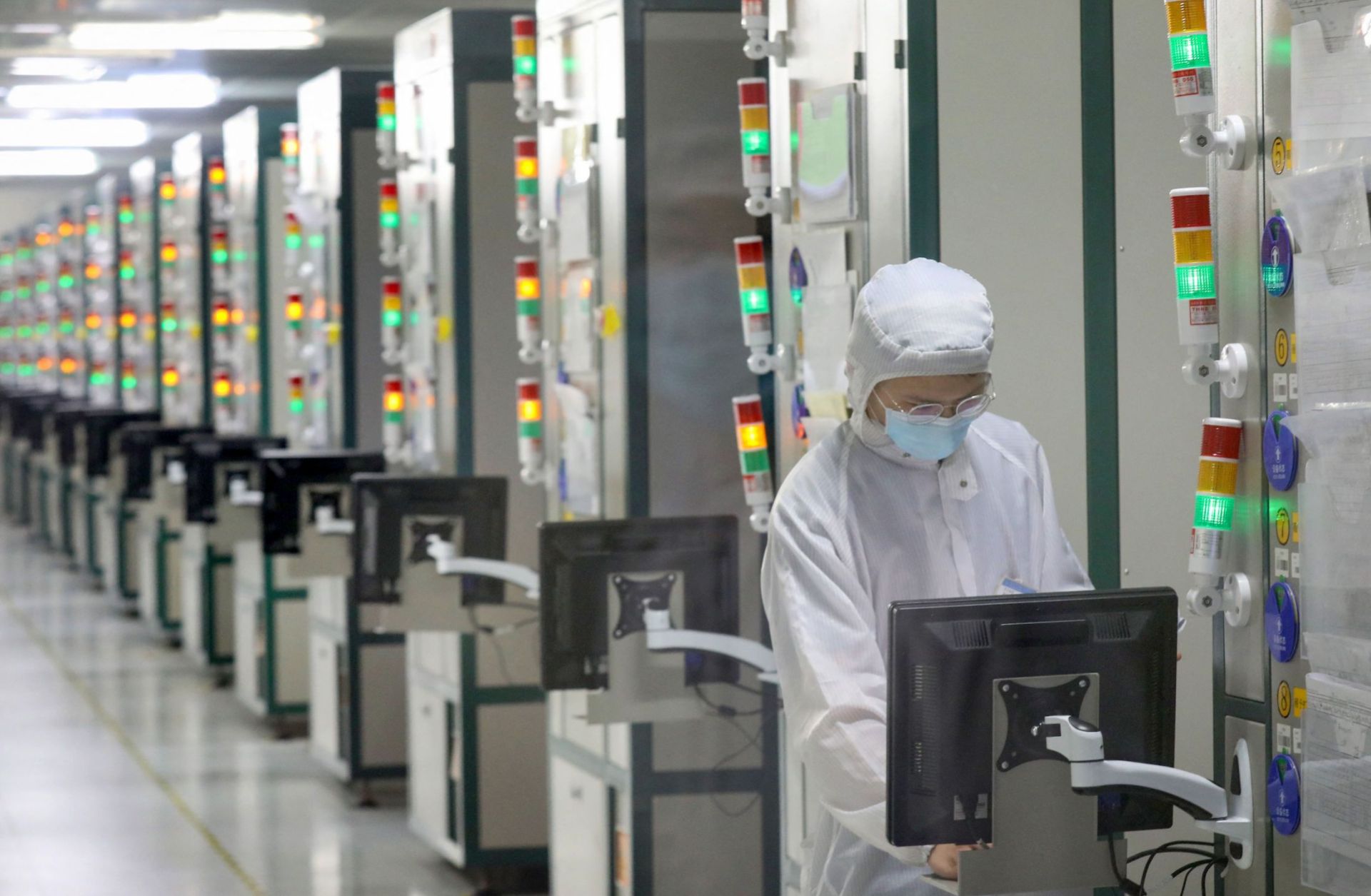 An employee works at a Jiangsu JieJie Microelectronics Co. Ltd. factory in Nantong, a city in eastern China's Jiangsu province on March 17, 2021. 