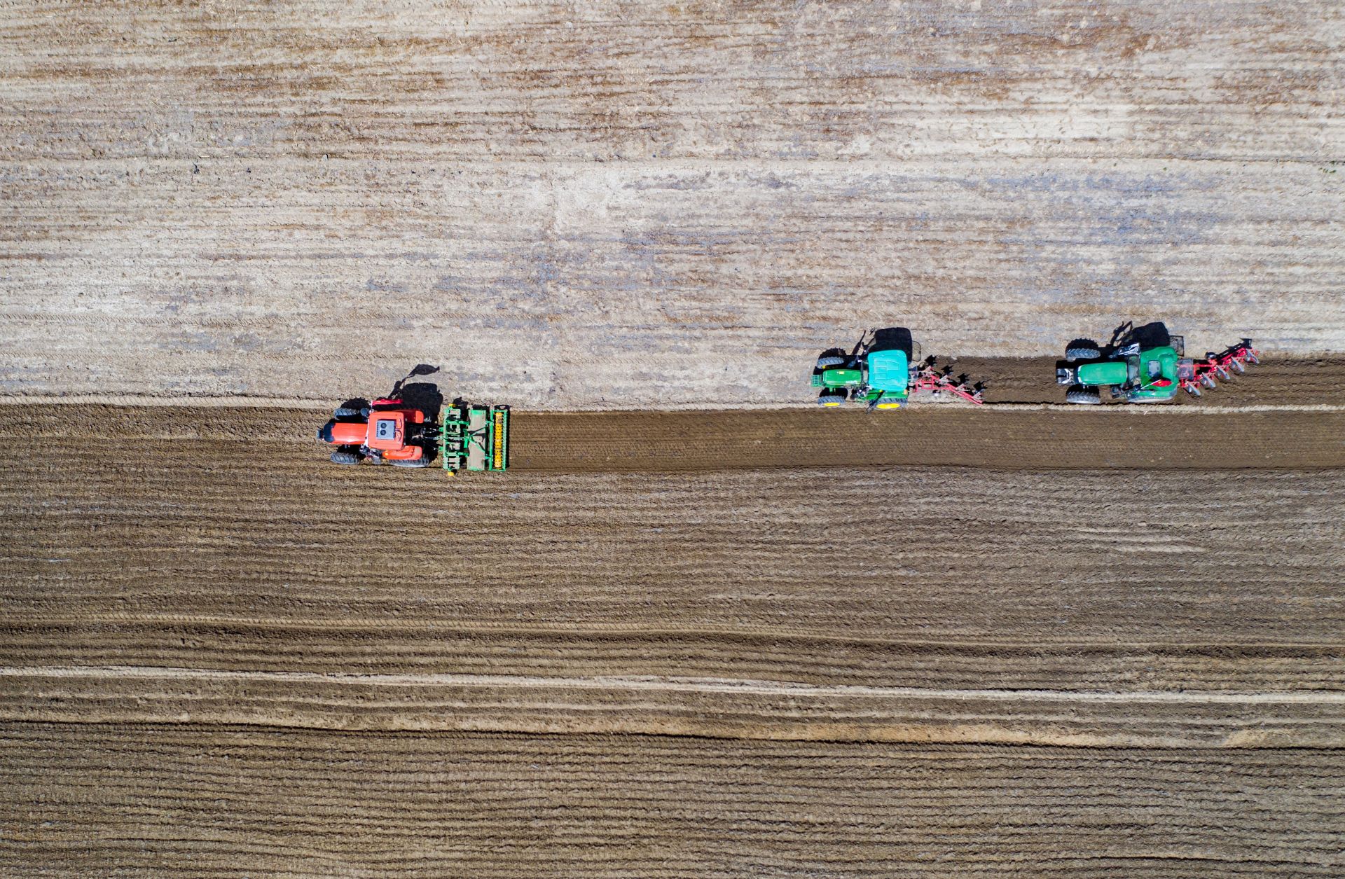 An aerial photo shows villagers sowing highland barley seeds with agricultural machinery in the fields in Lhasa, the capital of China's Tibet Autonomous Region, on April 22, 2020. An aerial photo shows villagers sowing highland barley seeds with agricultural machinery in the fields in Lhasa, the capital of China's Tibet Autonomous Region, on April 22, 2020.