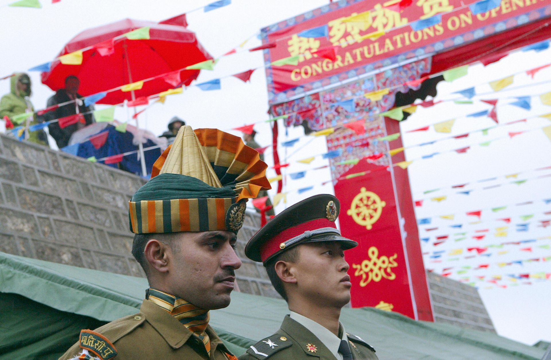 Members of the Chinese and Indian armed forces attend a ceremony marking the opening of the border between India's Sikkim state and Tibet at Nathu La pass in the Himalayas.