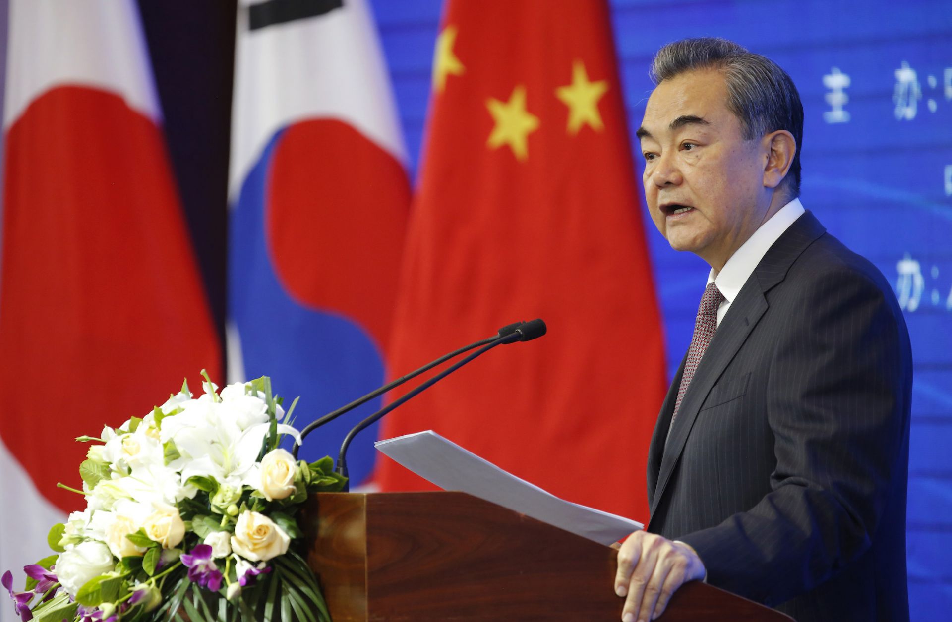 Chinese Foreign Minister Wang Yi speaks at the opening ceremony of the International Forum for Trilateral Cooperation that commemorated the 20th anniversary of trilateral cooperation among China, South Korea and Japan, in Beijing, China, on May 10, 2019. 