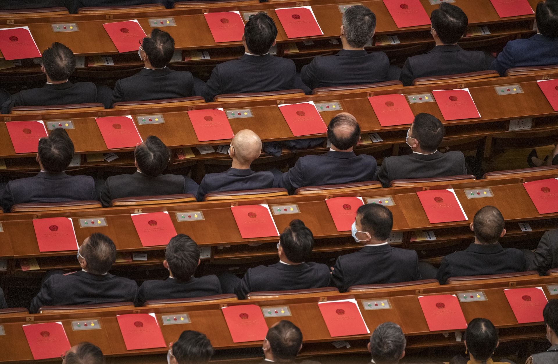 Delegates vote on resolutions during the closing session of China's National People's Congress on March 11, 2021.