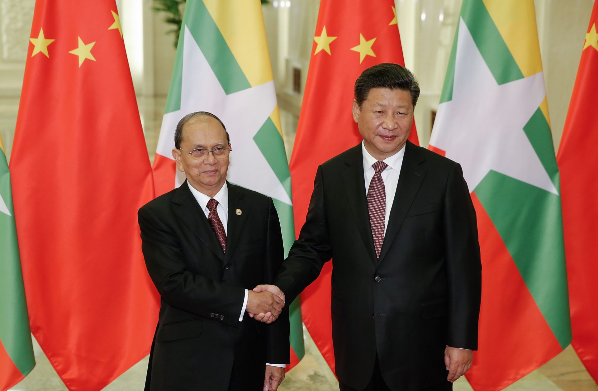 Chinese President Xi Jinping shakes hands with Myanmar's President Thein Sein at The Great Hall Of The People in Beijing, China. 