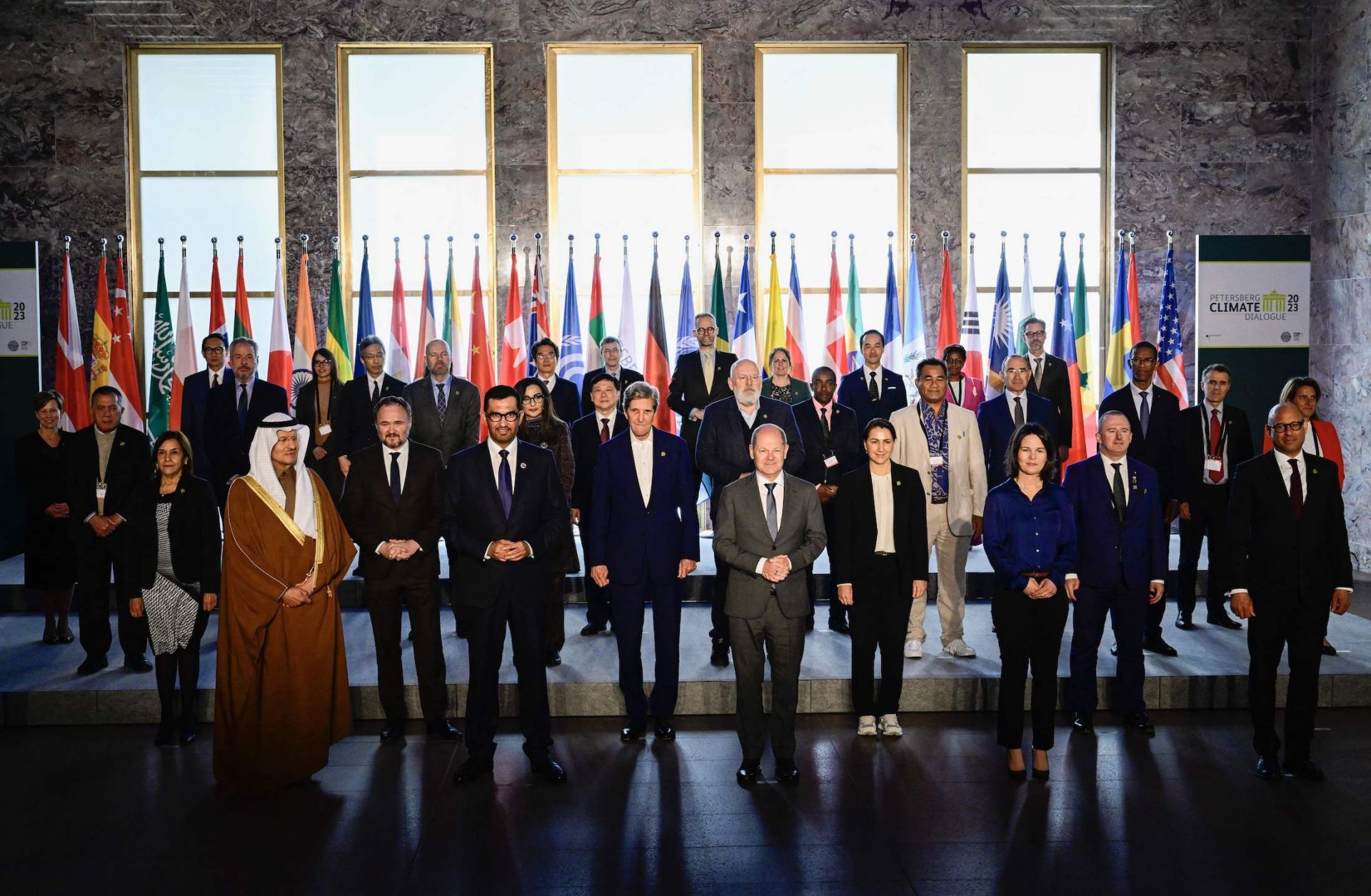 COP28 President-Designate and the UAE's Special Envoy for Climate Change, Sultan al-Jaber (front row, fourth from left) -- poses for a group photo along with U.S. Climate Envoy John Kerry, German Chancellor Olaf Scholz, German Foreign Minister Annalena Baerbock and other participants in the Petersberg Climate Dialogue on May 3, 2023, in Berlin, Germany.