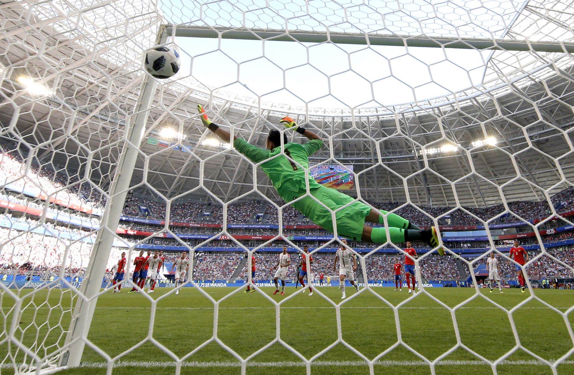 Keylor Navas, a goalkeeper for Costa Rica's national soccer team, tries to block a shot in a match against Serbia during the 2018 World Cup.