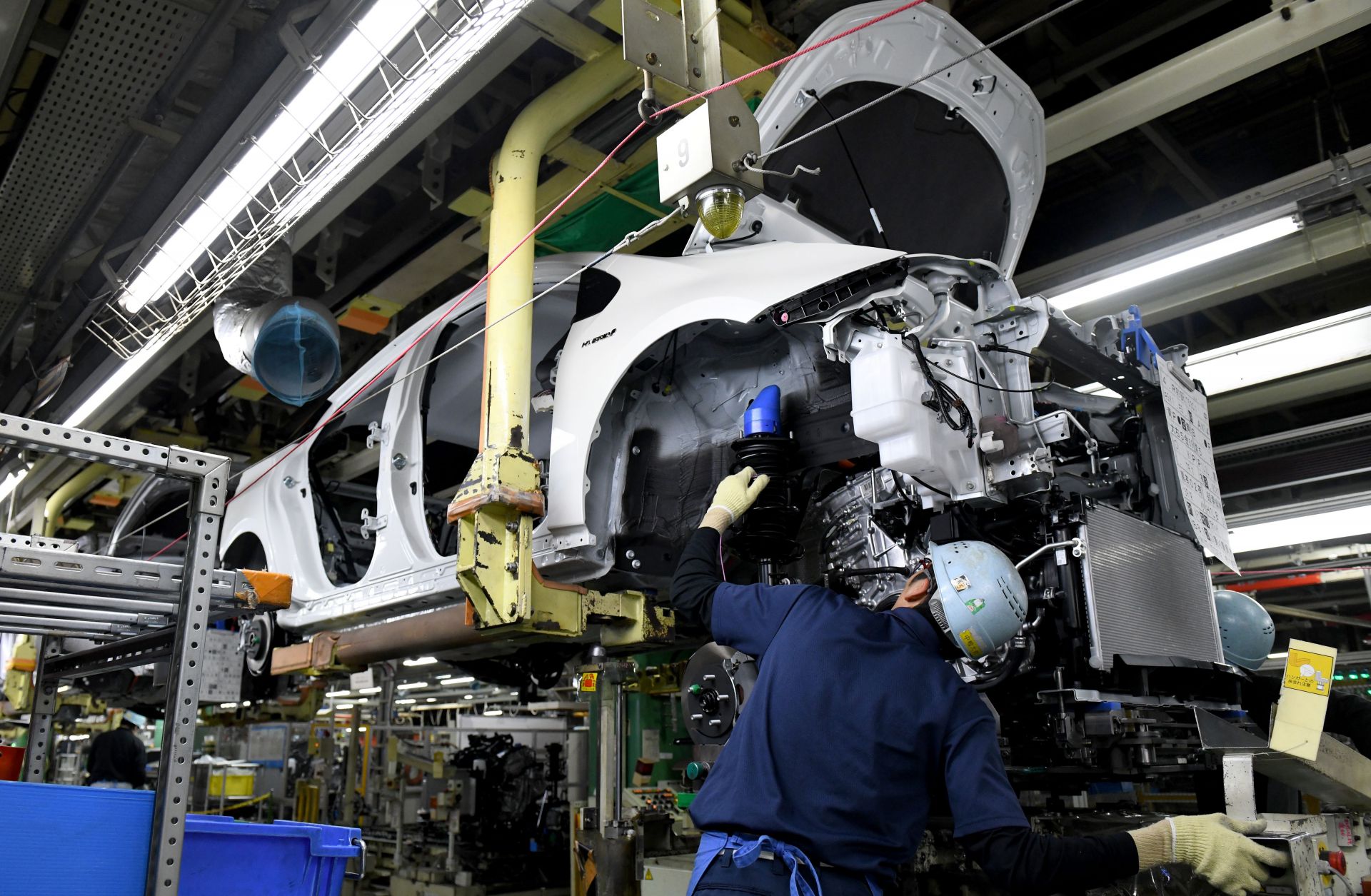 Workers in Toyota City in Japan's Aichi prefecture assemble a Prius. Japan's auto manufacturing sector is heavily export-driven, and the United States is a prime destination for its cars.