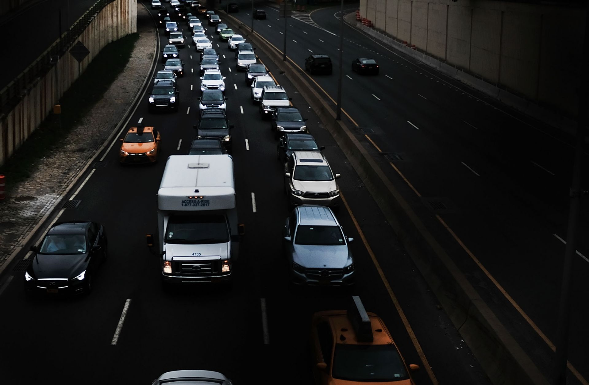 This image shows vehicles traveling through Brooklyn. The White House will decide soon whether to claim the power to impose tariffs on auto imports it deems unfair.
