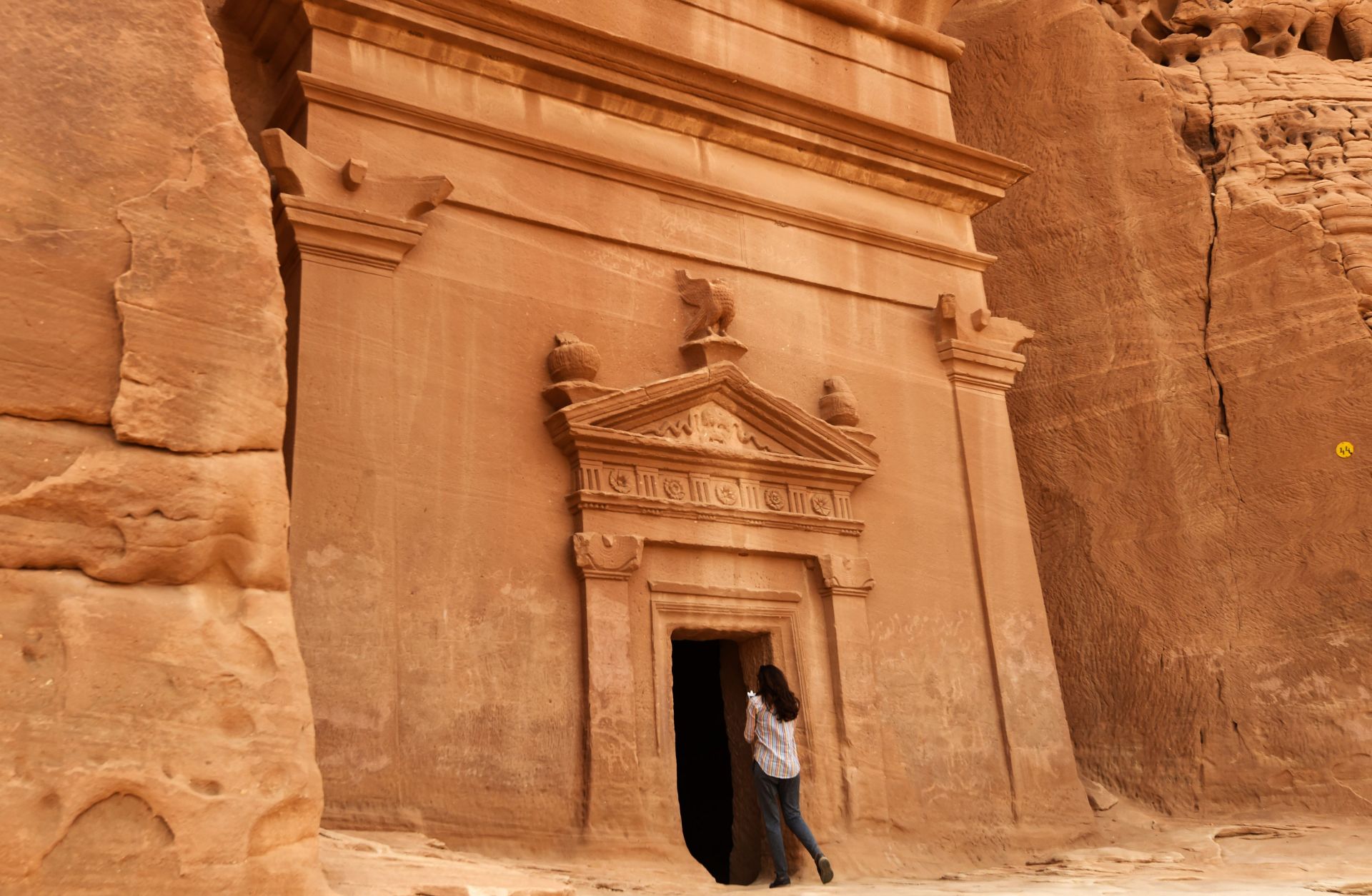 The tombs at Madain Saleh in northwest Saudi Arabia are a UNESCO World Heritage site and date to the first century. A journalist takes a picture of a tomb at Madain Saleh, a UNESCO World Heritage site, in Saudi Arabia's northwest on March 31, 2018.