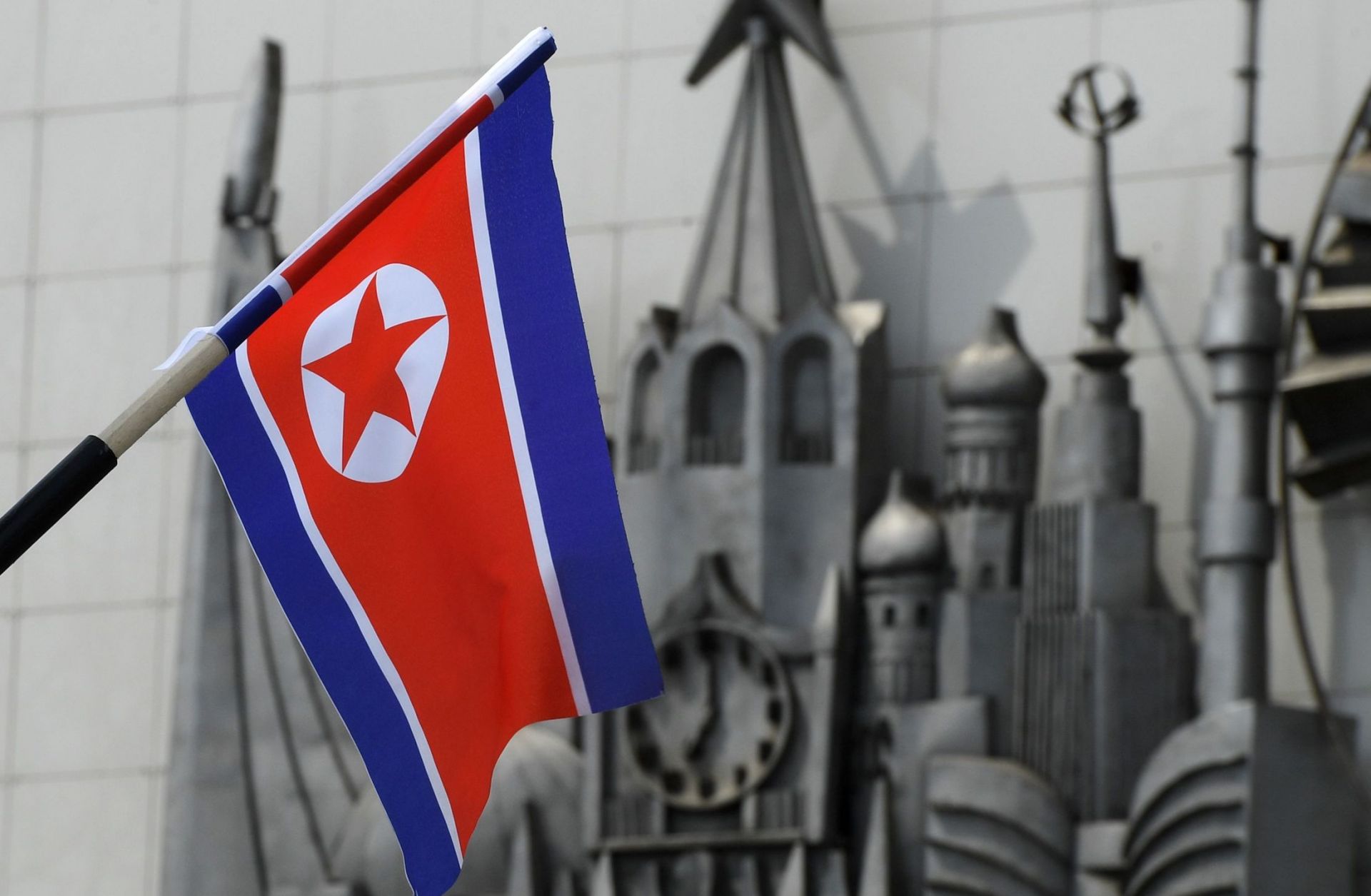 A North Korean flag is seen fixed on a lamp post in the far-eastern Russian port of Vladivostok on April 25, 2019. 