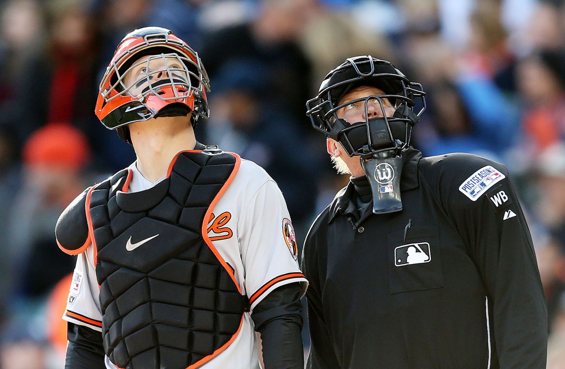 Baseball player Nick Hundley and umpire Jeff Kellogg watch a drone flying over Detroit's Comerica Park in 2014.