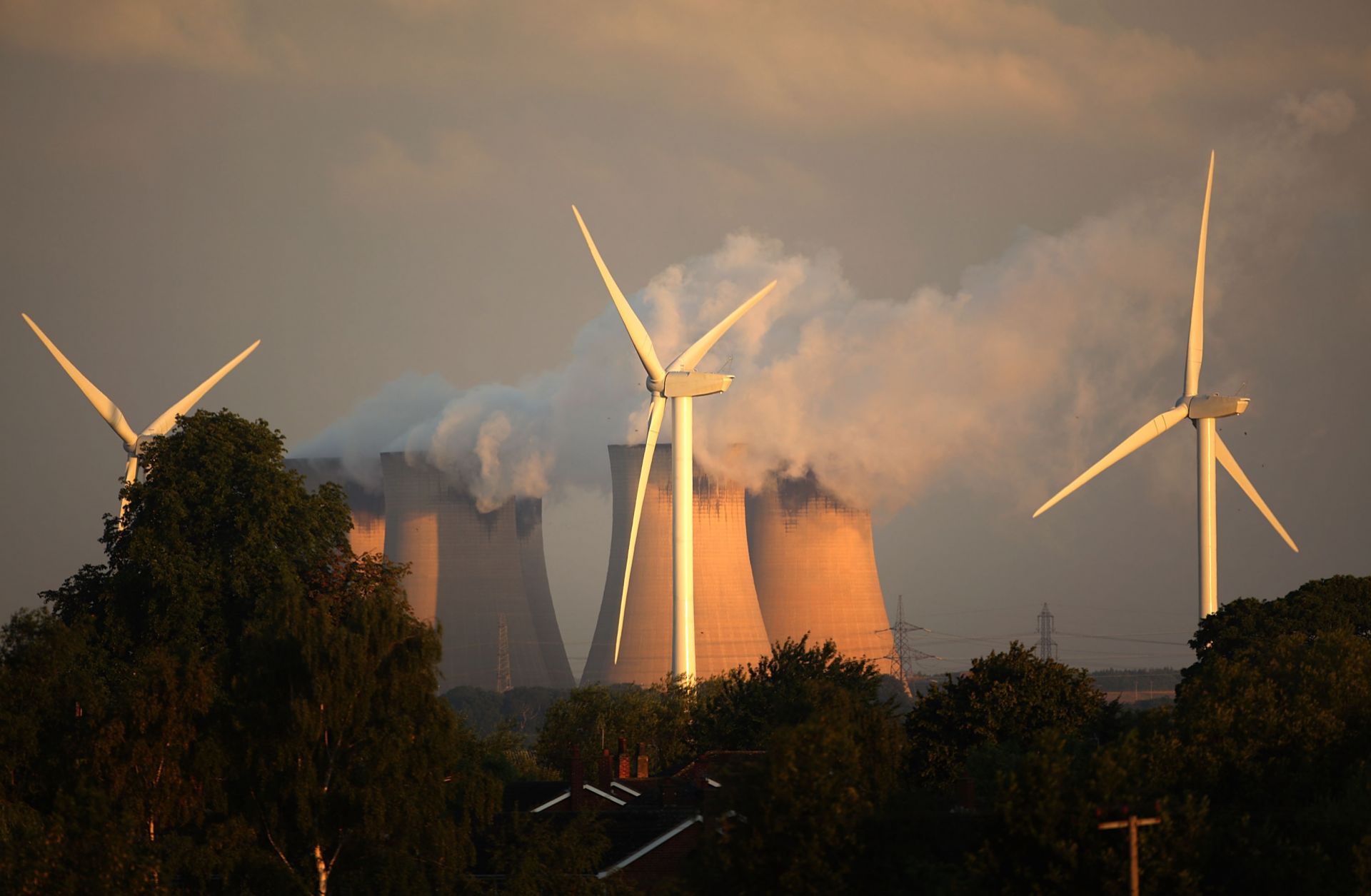 Wind turbines spin alongside the Drax power station, the biggest coal-fired plant in Europe.