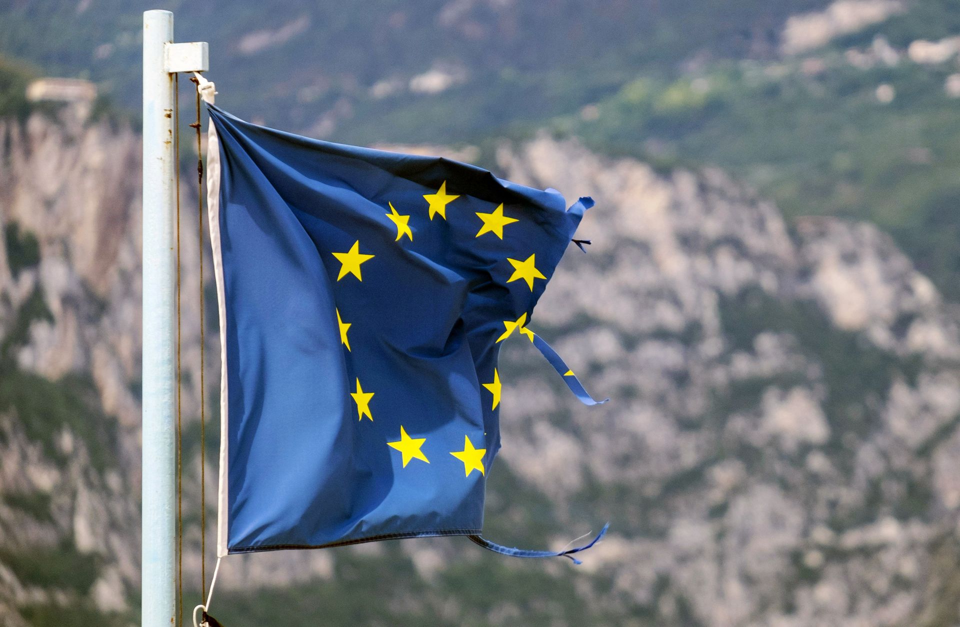 A damaged EU flag is seen in Brenzone, Italy, on Aug. 14, 2019. A damaged EU flag is seen in Brenzone, Italy, on Aug. 14, 2019.