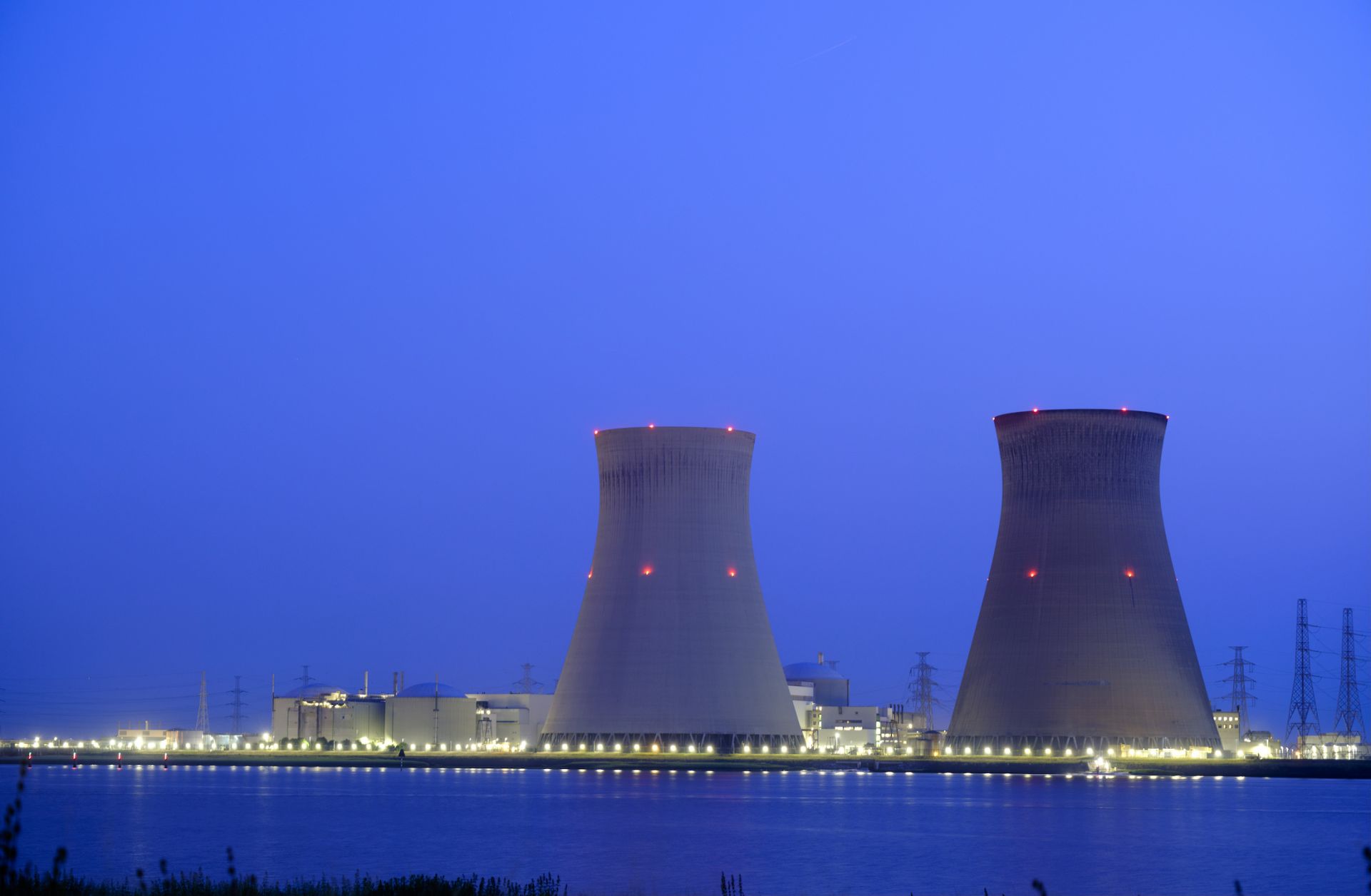 The Doel nuclear power station is seen at night on June 10, 2023, in Antwerp, Belgium. 