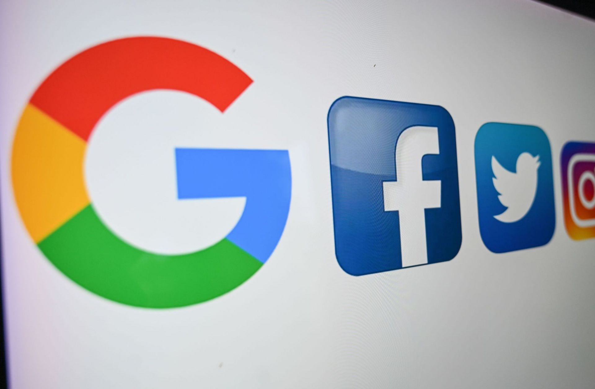 A photo taken on Oct. 21, 2020, shows the logos (left to right) of Google, Facebook, Twitter, Instagram, Snapchat and TikTok on a computer screen. A photo taken on Oct. 21, 2020, shows the logos (left to right) of Google, Facebook, Twitter, Instagram, Snapchat and TikTok on a computer screen.