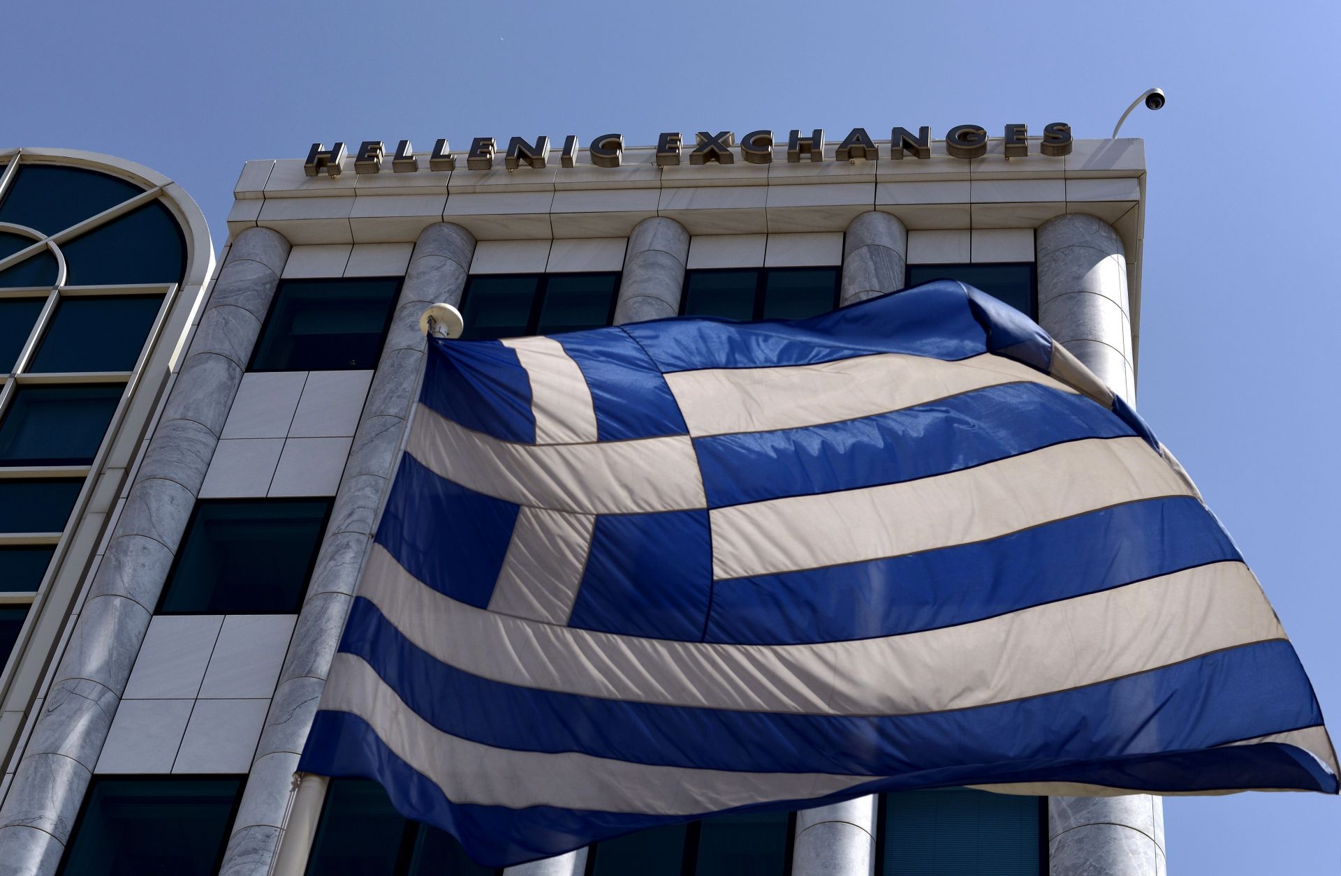 The Greek flag flies just outside the country's stock exchange. 