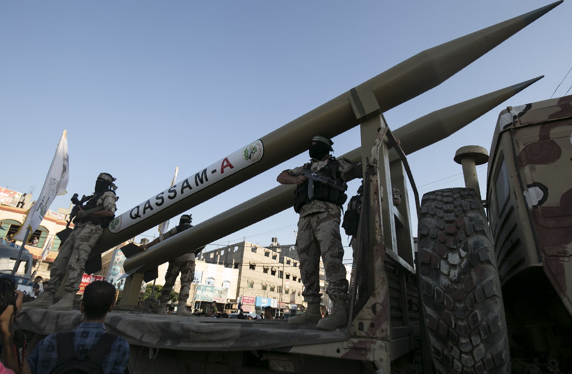 Palestinians from the armed wing of the Hamas movement, display Qassam home-made rockets during an anti-Israel military parade in Rafah in the southern Gaza Strip, Aug. 21, 2016.