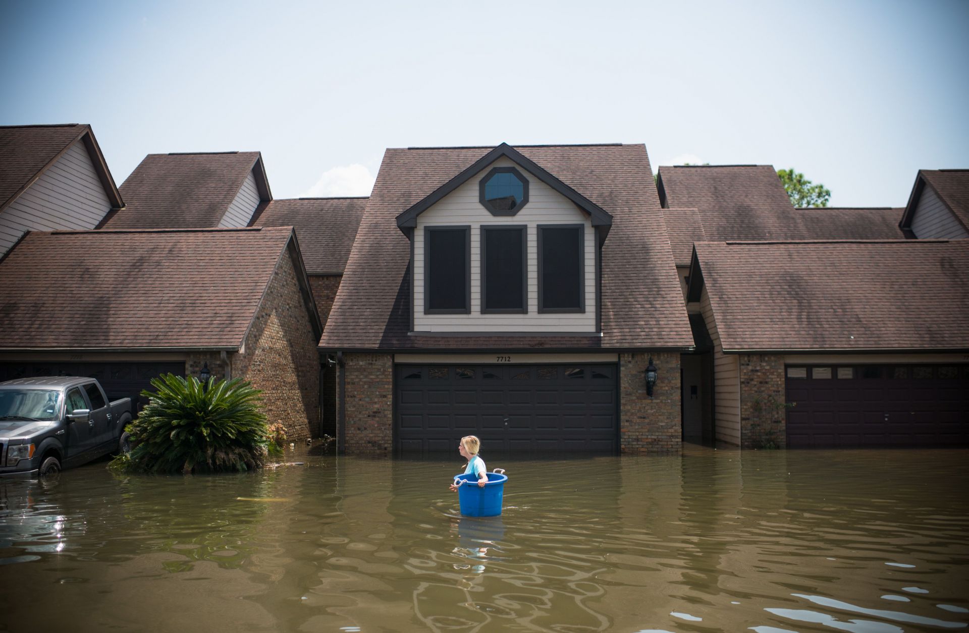 But as nature bruised and buffeted the U.S. mainland, natural and human disasters struck elsewhere in the world. A woman tries to recover items from her flooded home in Port Arthur, Texas, in the wake of Hurricane Harvey.