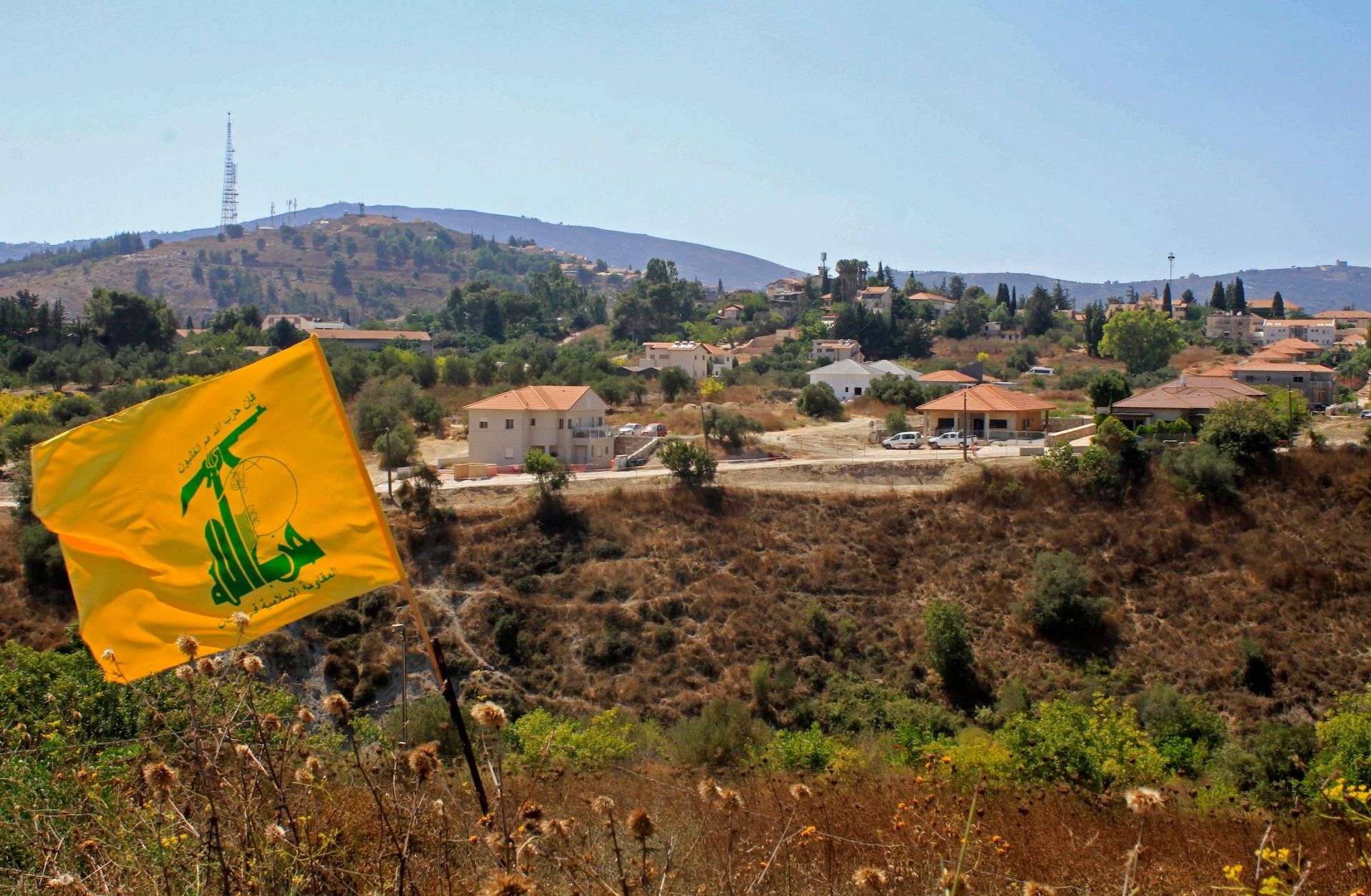 A Hezbollah flag flutters on the Lebanese side of the border with Israel on Sept. 2, 2019. 