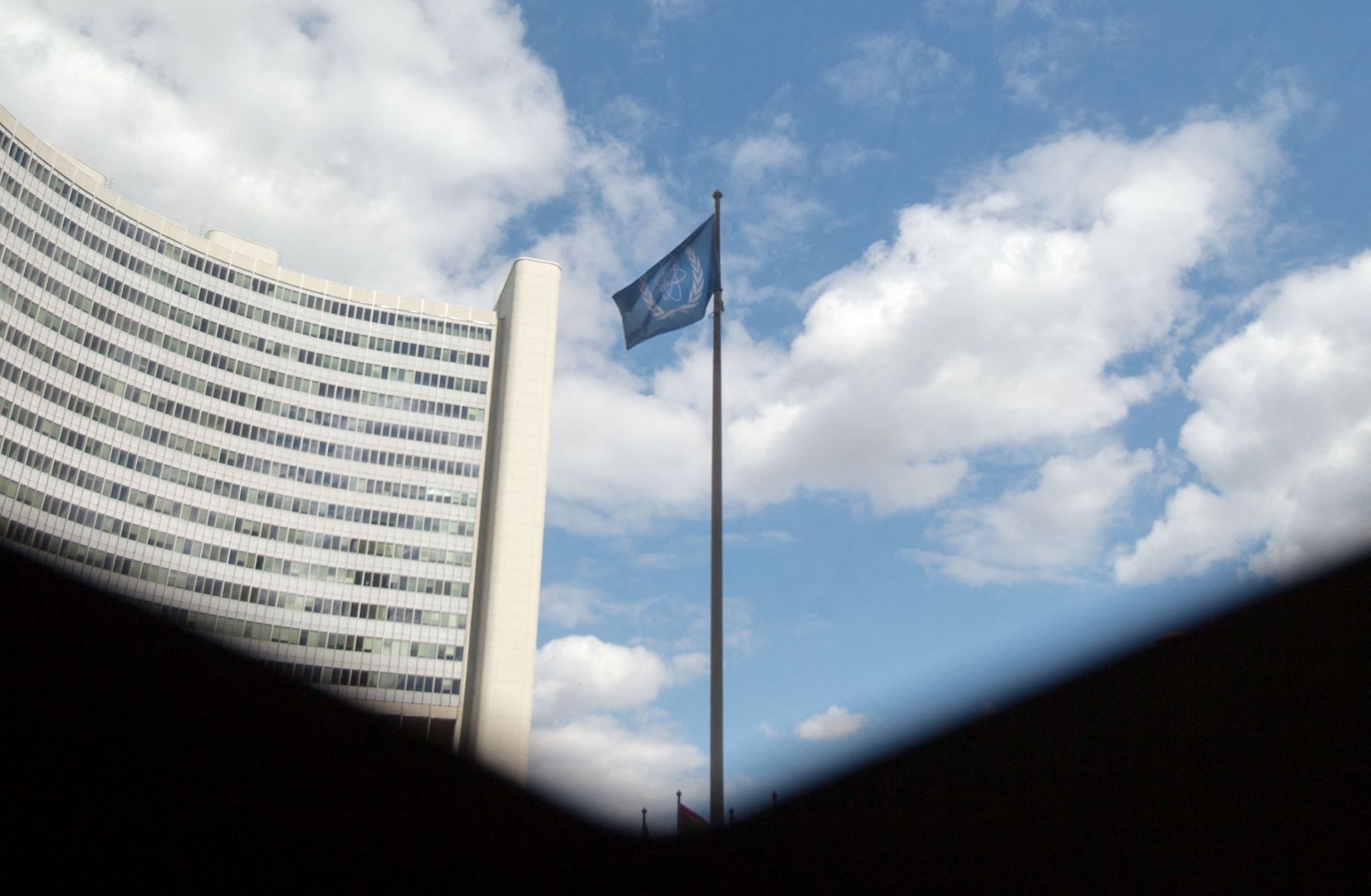 The flag of the International Atomic Energy Agency (IAEA) flutters in front of the IAEA building in Vienna, Austria, on July 10, 2019.