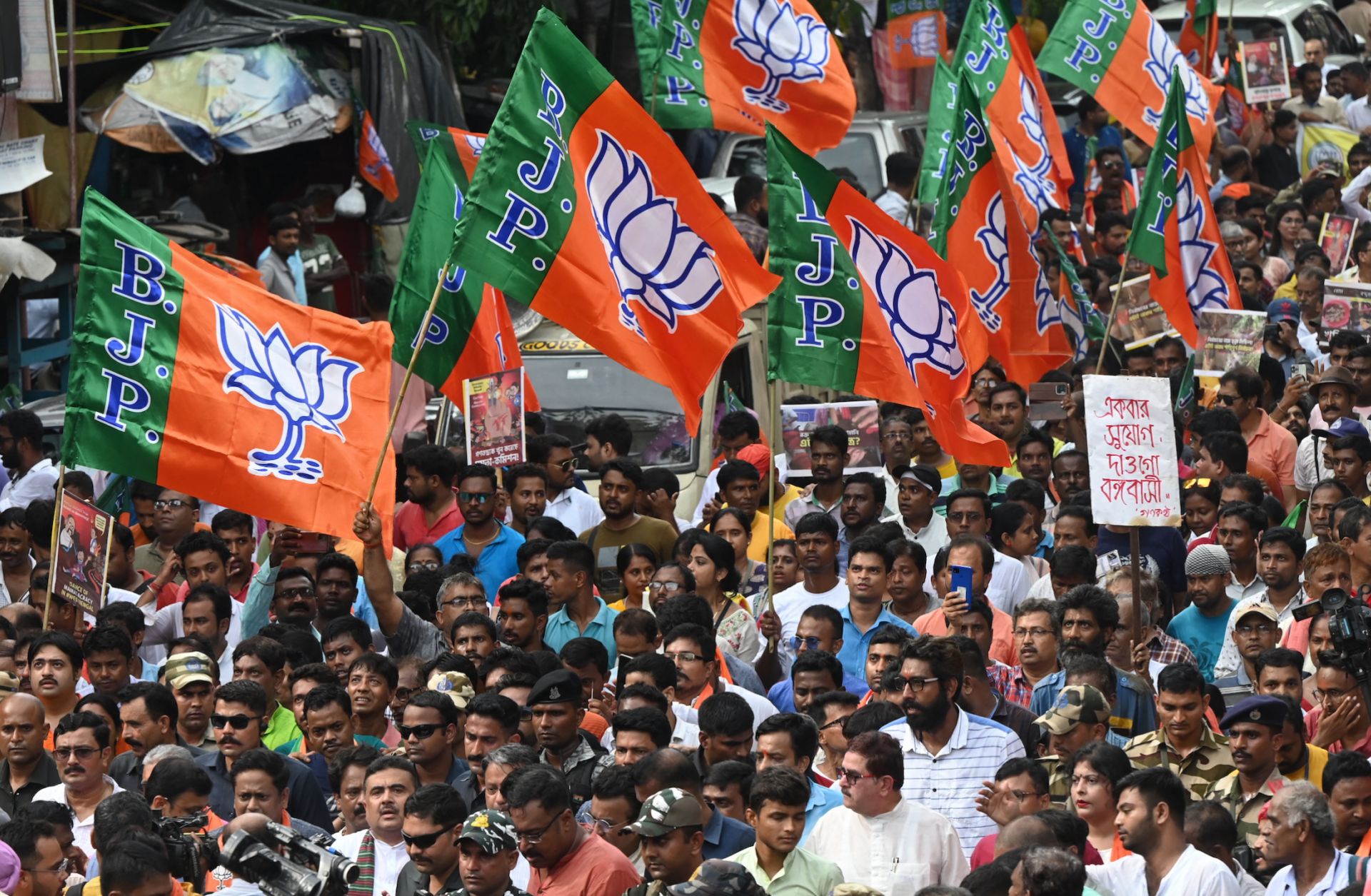 Supporters of India's ruling Bharatiya Janata Party (BJP) participate in a rally in Kolkata on July 19, 2023. 